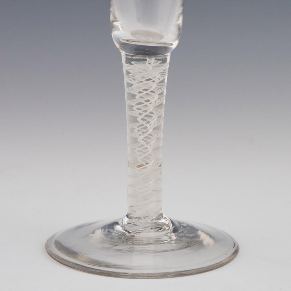 Heading : Opaque twist stem ratafia
Period : George II / George III - c1760
Origin : England
Colour : Clear
Bowl : Round funnel
Stem : A pair of 10-ply spiral bands with a pair of corkscrew tapes with accidental air layer. The spiral bands are