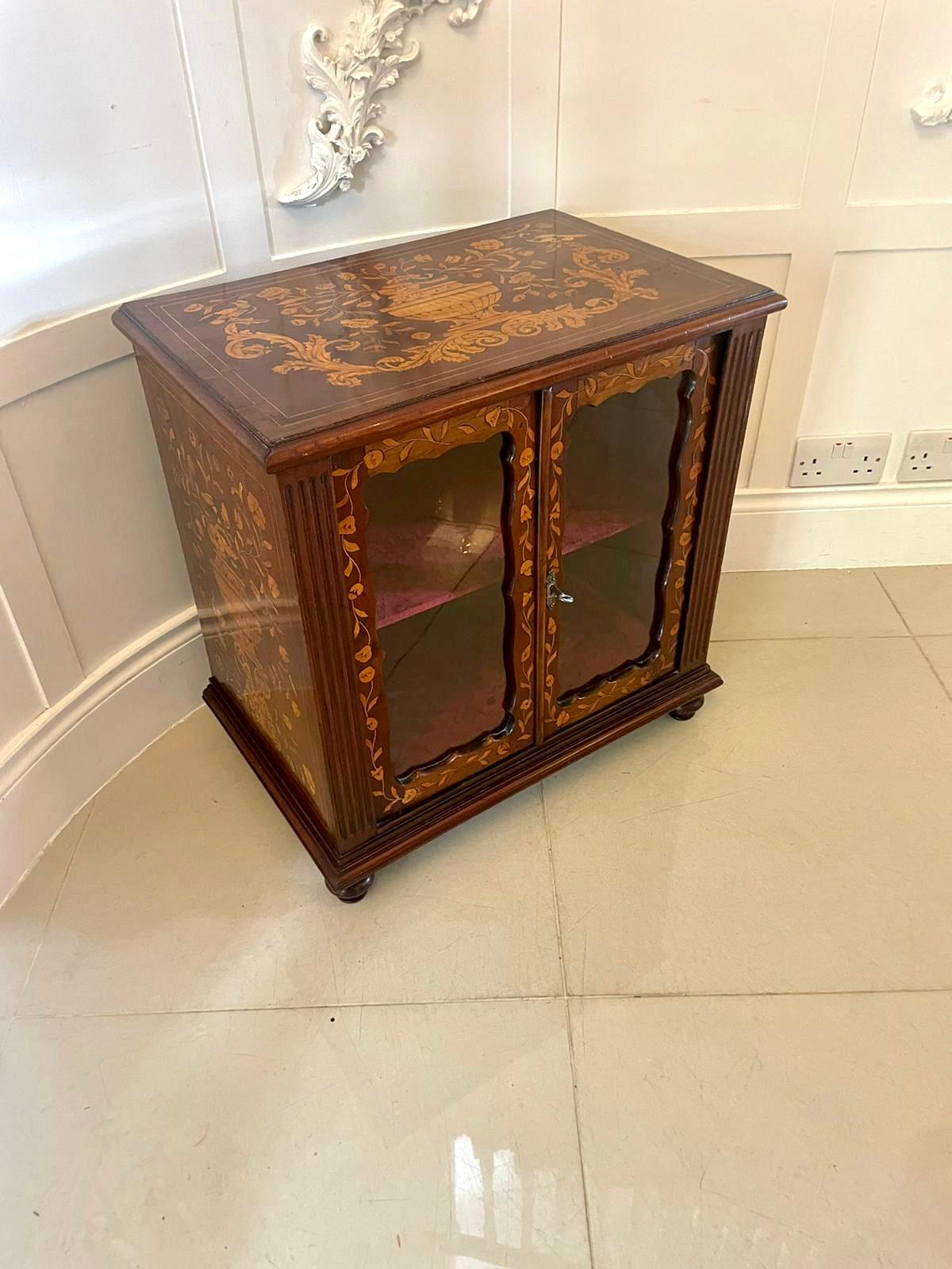 Unusual small Antique Victorian quality mahogany marquetry inlaid display cabinet having a quality beautiful mahogany marquetry inlaid top with a moulded edge above two glazed mahogany marquetry inlaid doors opening to reveal a shelf interior,