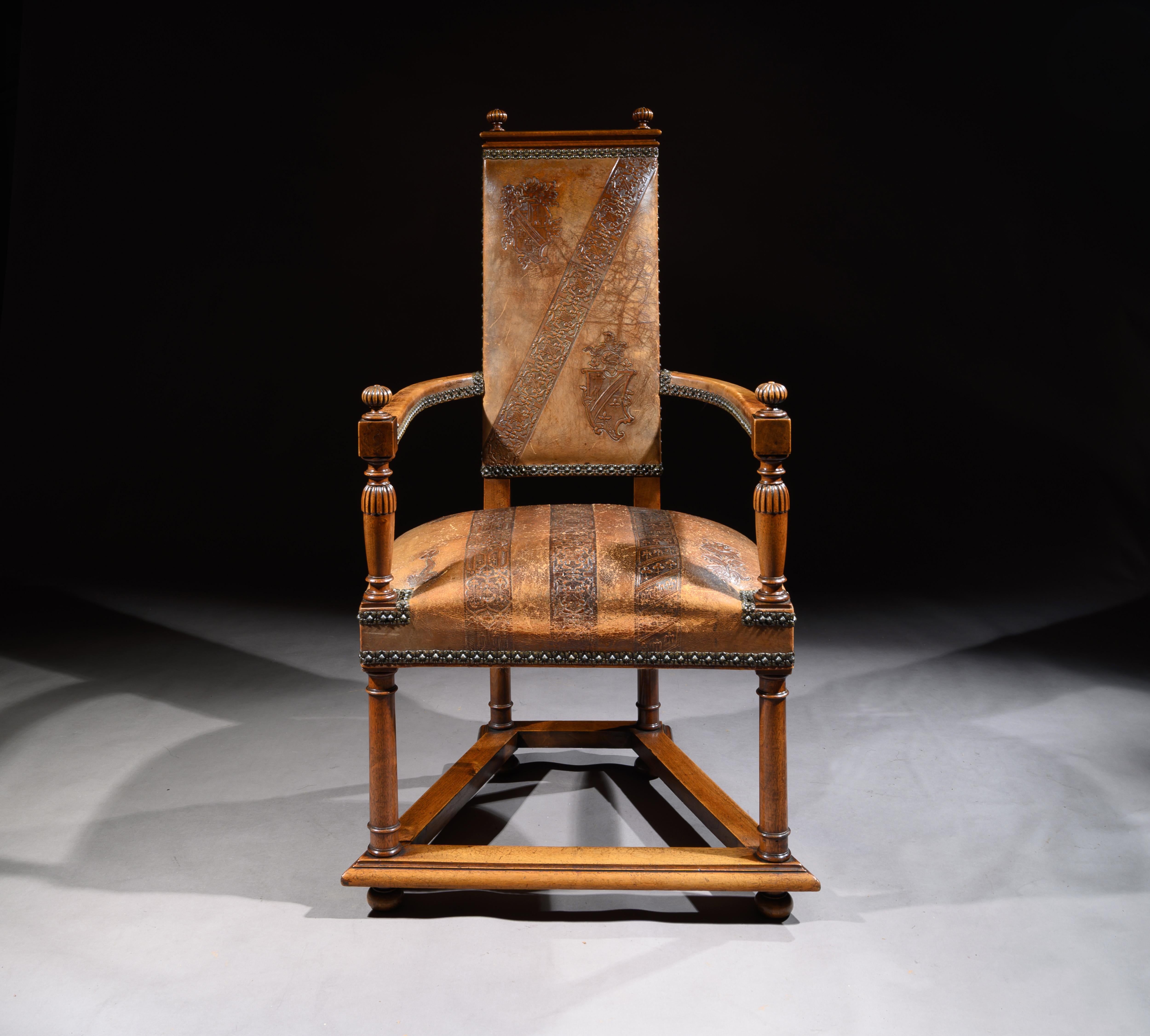 A very unusual walnut Spanish embossed tan leather open armchair.

Spanish, circa 1900.

Dating to the early 20th century of unusual design, this open armchair retains its wonderful embossed tan leather coats of arms and pattern work. The