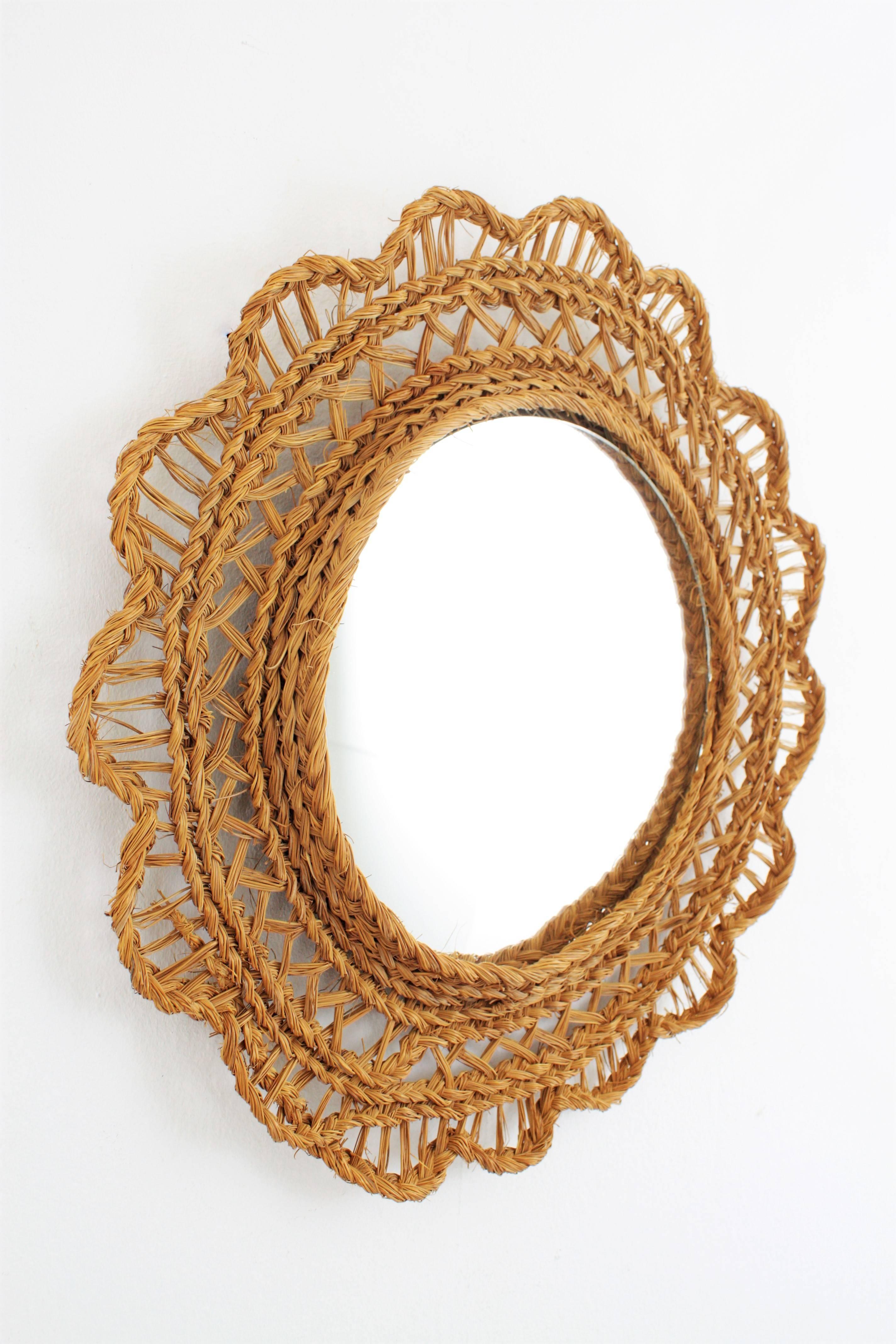 Lovely handcrafted esparto natural fiber mirror. Flower shaped esparto grass handwoven decorative frame surrounding a circular glass. Lovely to add a fresh touch to a beach or cottage house, Spain, 1950s-1960s.
Glass dimensions: 29cm