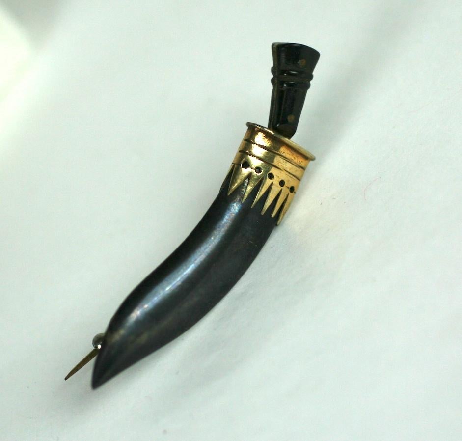 Charming and unusual Scabre Stickpin in gilded and patinaed sterling. Knife can be removed from sheath. Late 19th Century. 
2.5