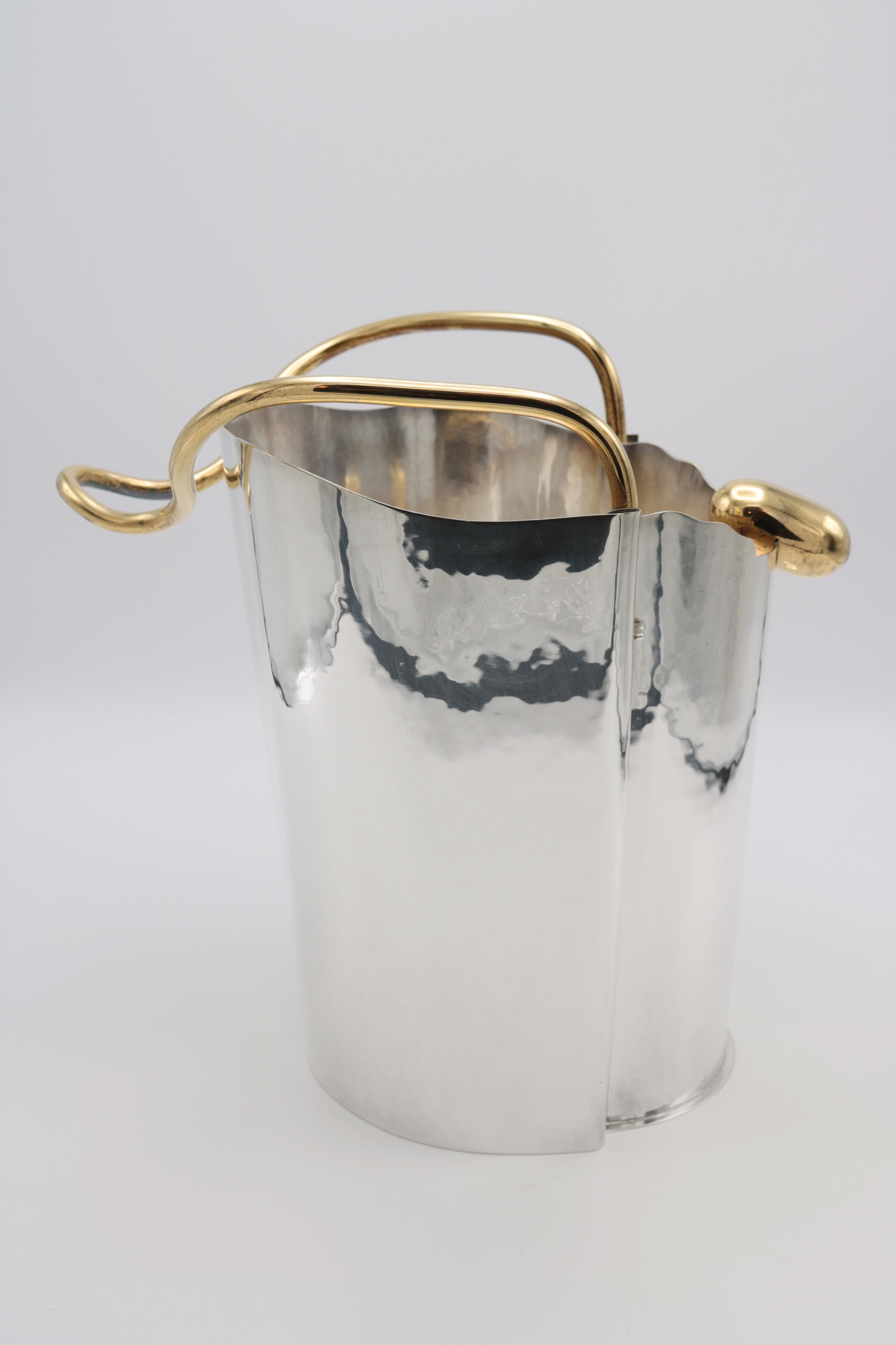 A sterling silver champagne cooler designed by Borek Sipek for Cleto Munari. 
Hand hammered sterling silver with gold-plated handles.
Signed on the bottom: Borek Sipek per Cleto Munari and numbered 16/99.