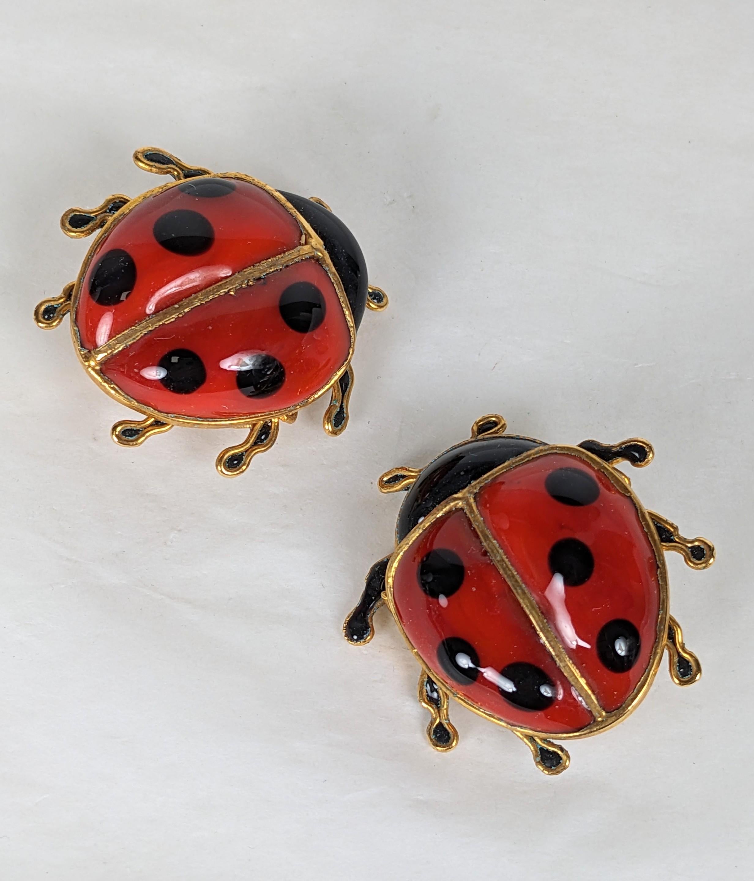 Unusual Surrealist Maison Gripoix Lady Bug Earrings from the 1980's likely for Dominique Aurientis. These are unsigned but we have handled lady bug motifs of hers before. 
Beautifully hand crafted in red and black poured glass in gilt bronze with