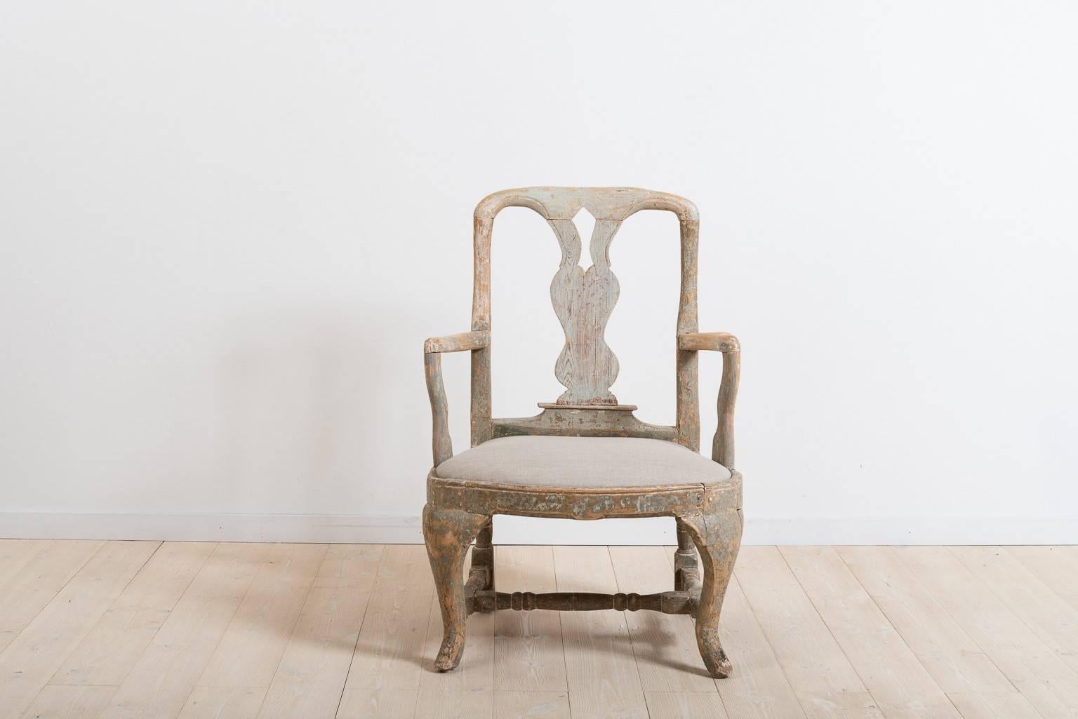 An unusual Swedish 18th century Baroque armchair, circa 1760, dry scraped back to its original color.