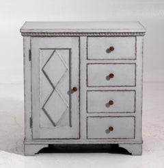 Unusual Swedish chest with four drawers and a door, 19th C.