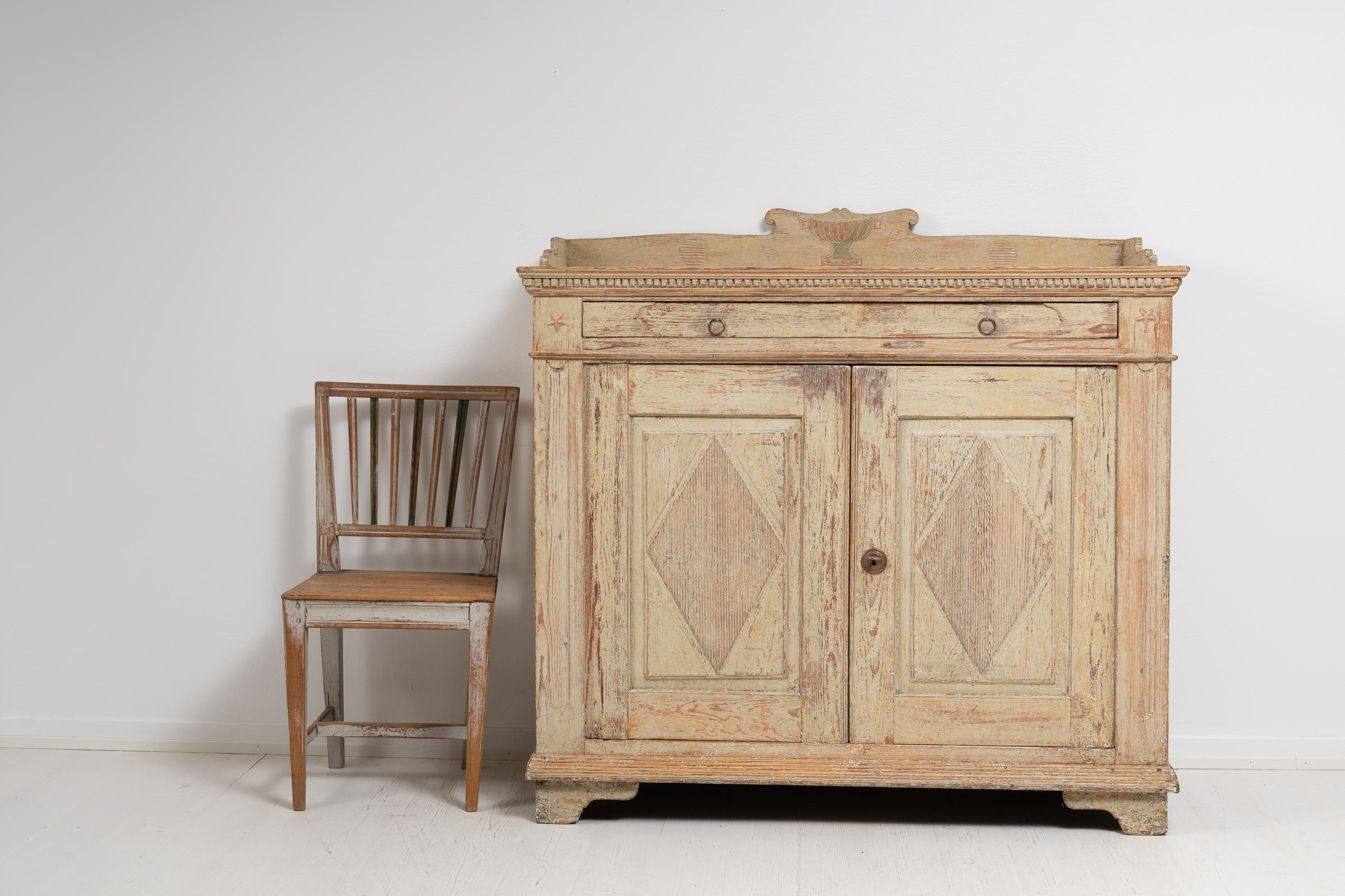 Swedish unusual and genuine sideboard from around year 1800 in the transitional time between the gustavian and empire periods. The sideboard was made in northern Sweden in pine and has the original paint from the first few years of the 19th