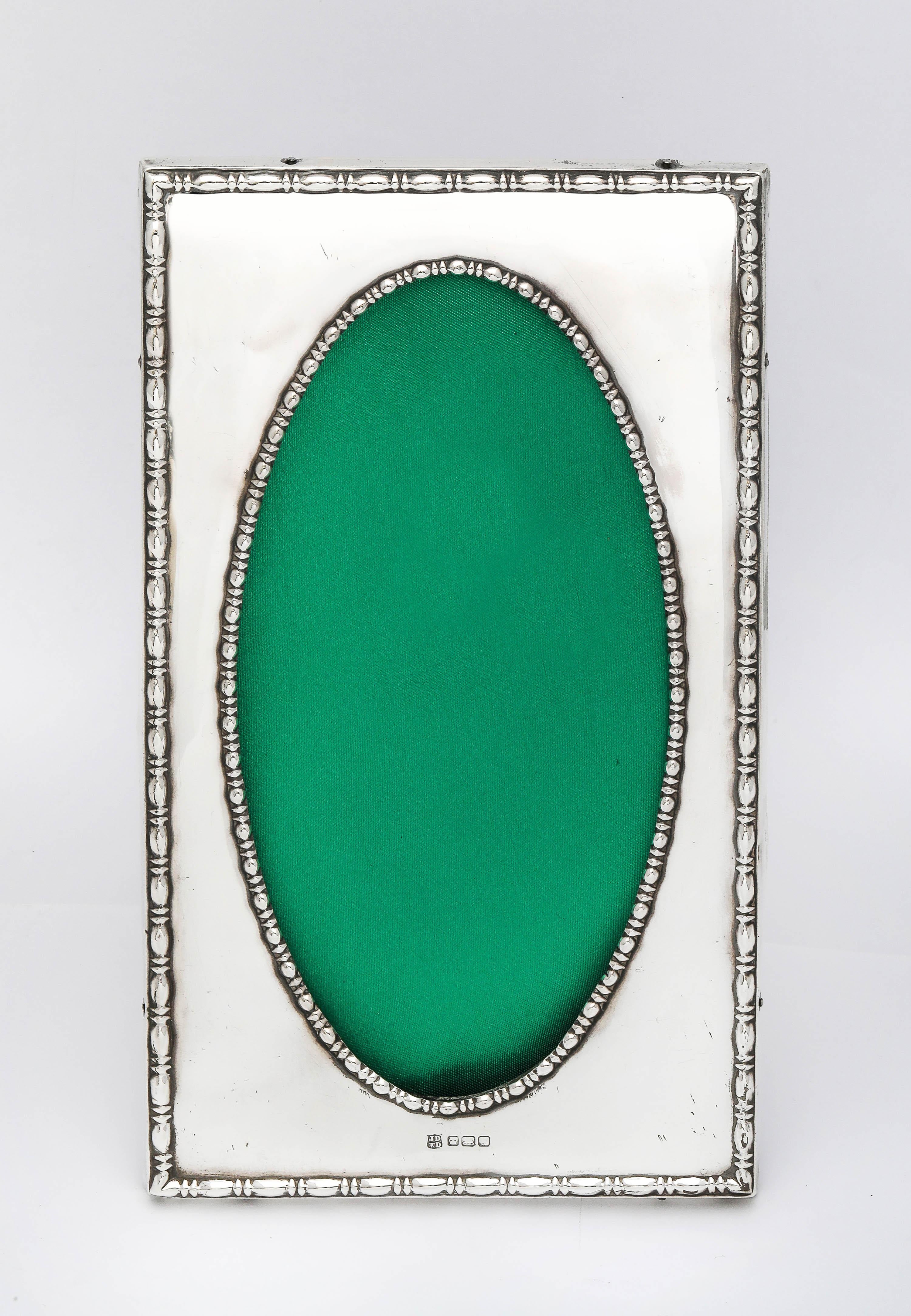Unusual, tall, Edwardian Period, sterling silver, wood-backed picture frame, Sheffield, England, year-hallmarked for 1914, James Deakin and Sons (John and William F. Deakin) - makers. The frame will stand both horizontally and vertically. The frame