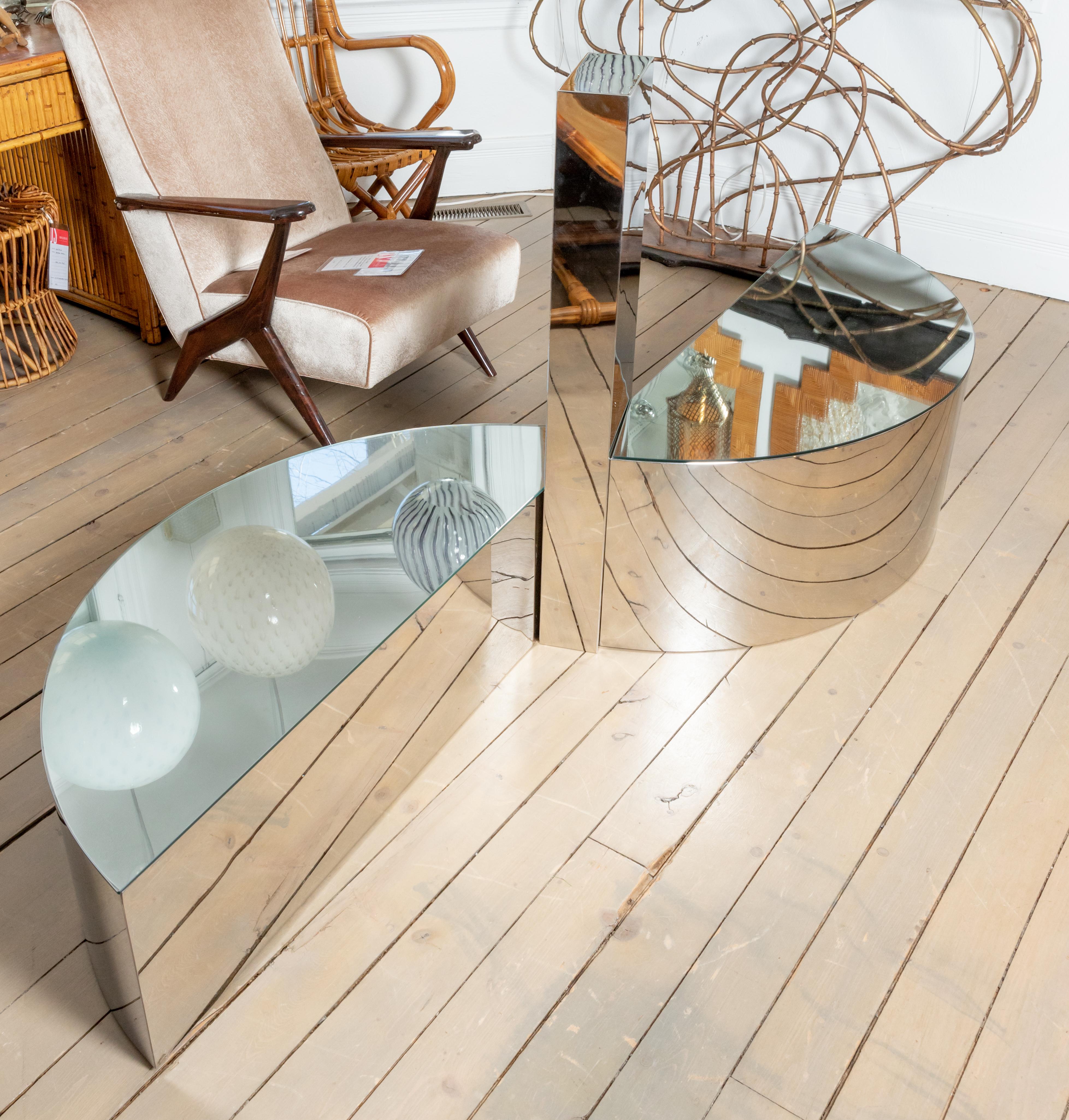 Unusual three section freeform stainless steel coffee table with glass tops.