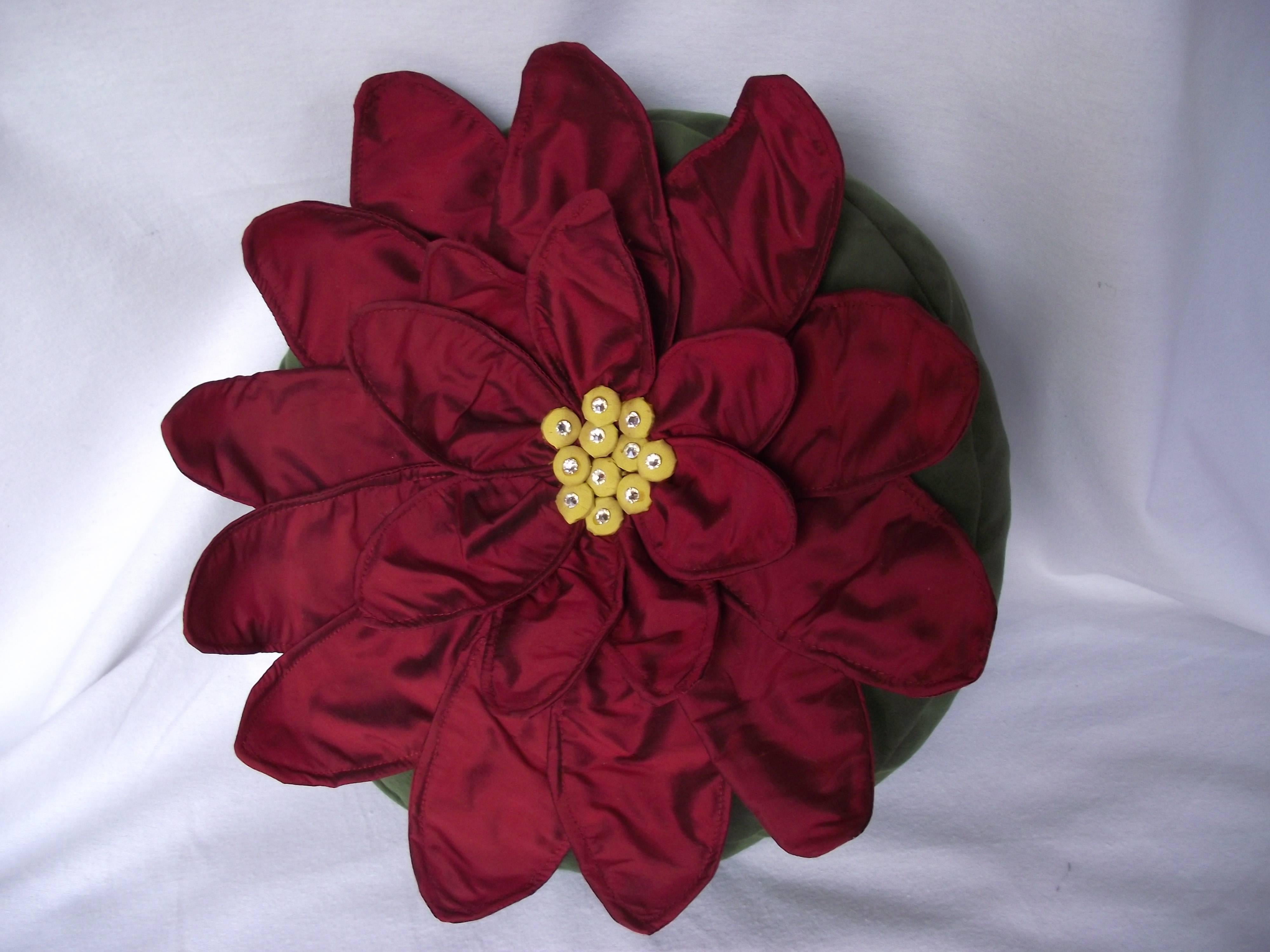 This new pillow design from Gantt Design Studio is called Red Shasta Daisy. Like the others each flower petal is individually wired. The Daisy is made of Red Silk and the pillow is made of green velvet. It is limited to five of each pillow. In truth