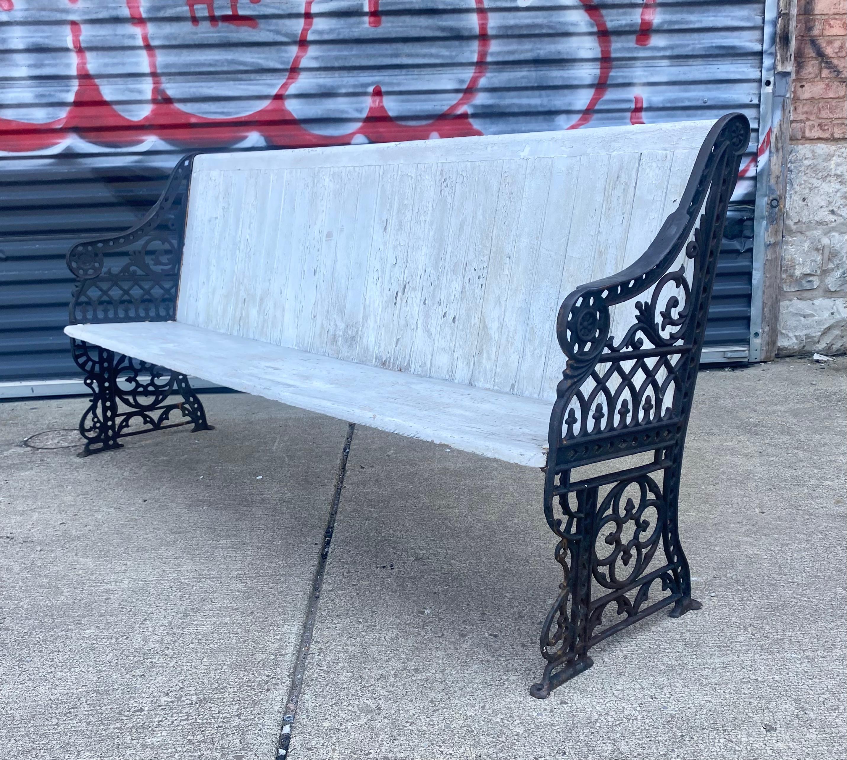 Unusual Train / Bus Terminal Cast Iron and Wood bench ....Wonderful design and proportion.. Several layers of old paint,, Would be a fabulous garden bench, Arm height 24