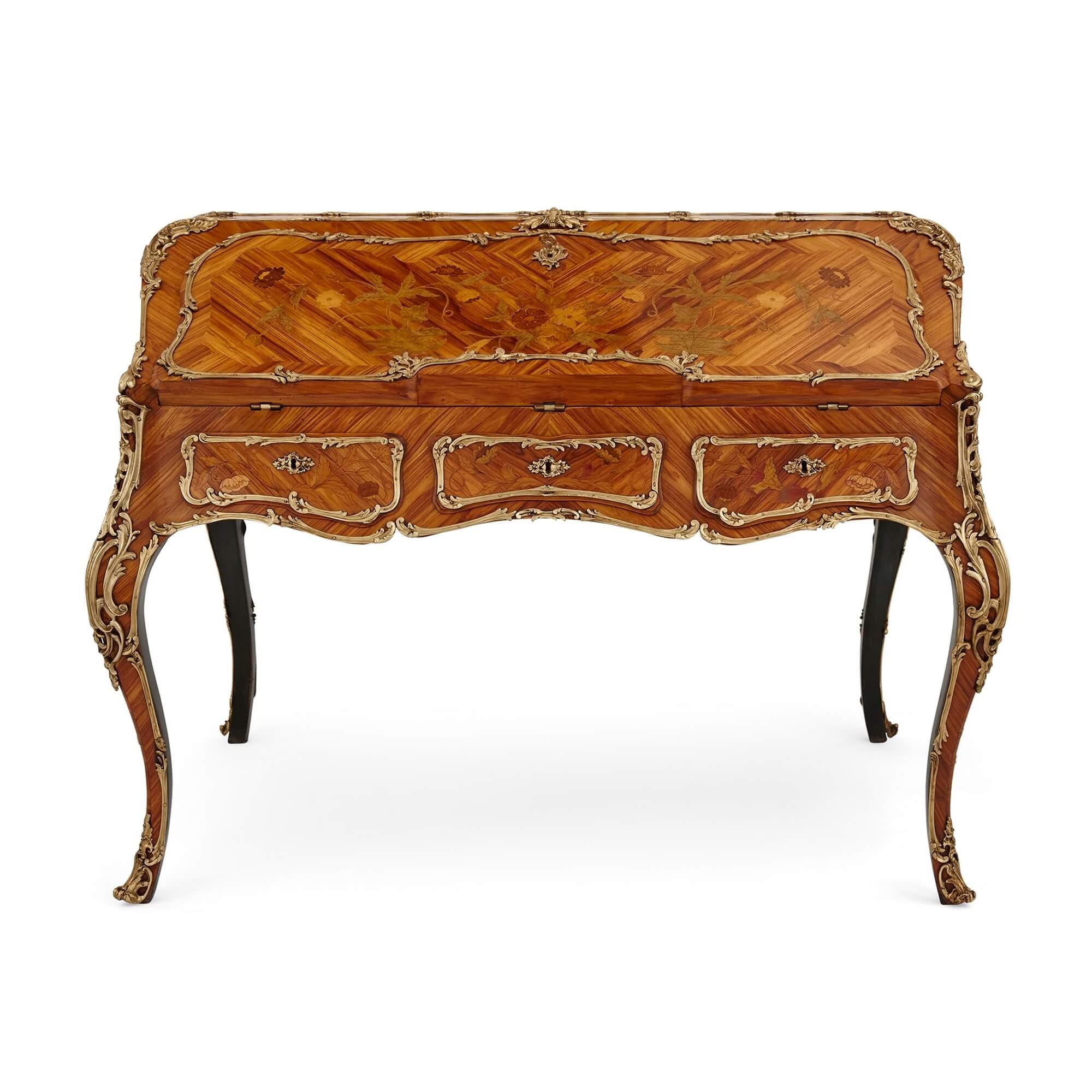 Unusual Transition style marquetry and gilt bronze double sided writing desk
French, early 20th Century
Height 98cm, width 130cm, depth 94cm

This rare doubled-sided writing desk is a superb piece of nineteenth-century French decorative art,