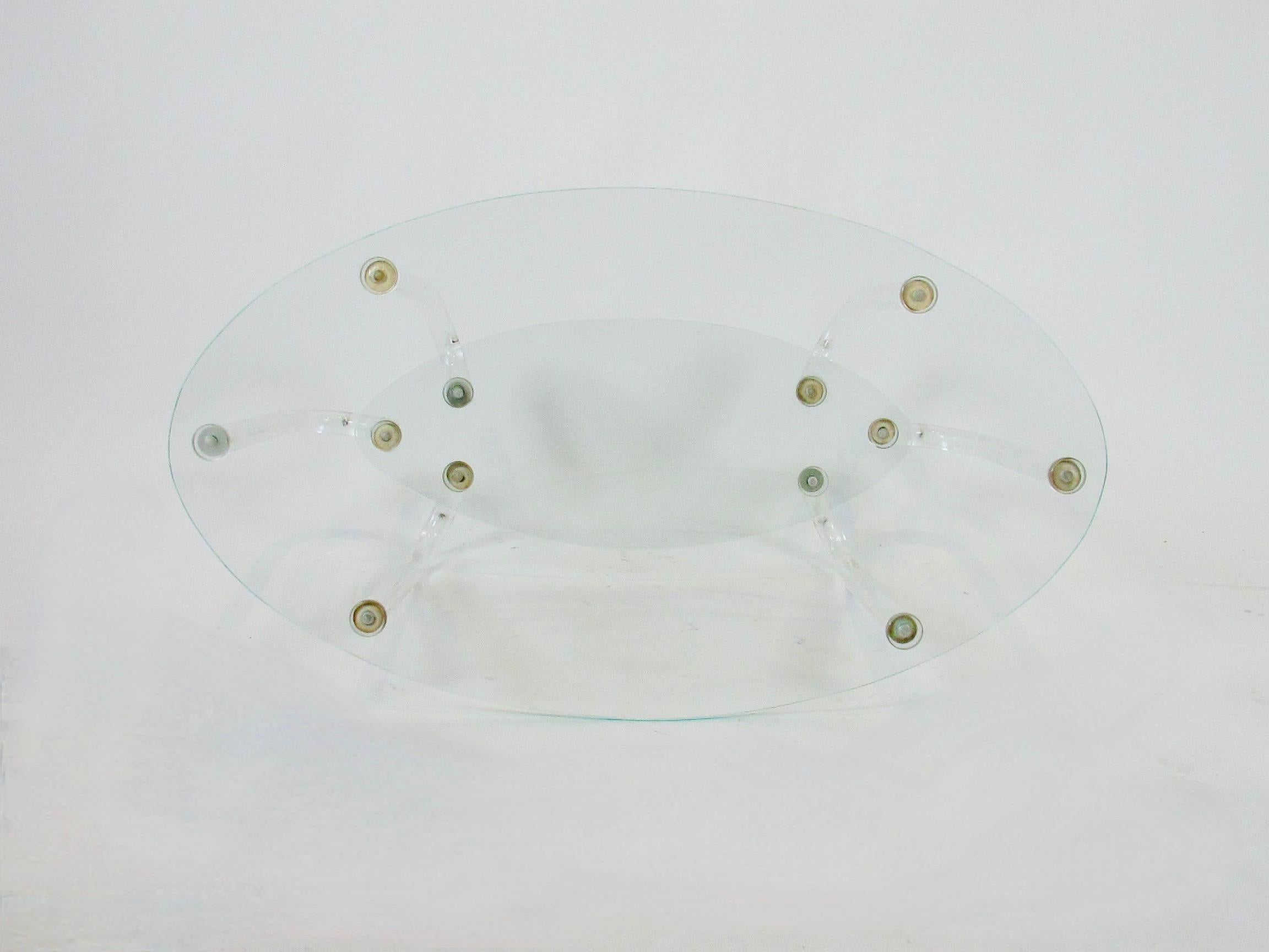 Glass Unusual Two Tier Hollywood Regency Oval Top Table on Six Lucite Legs For Sale