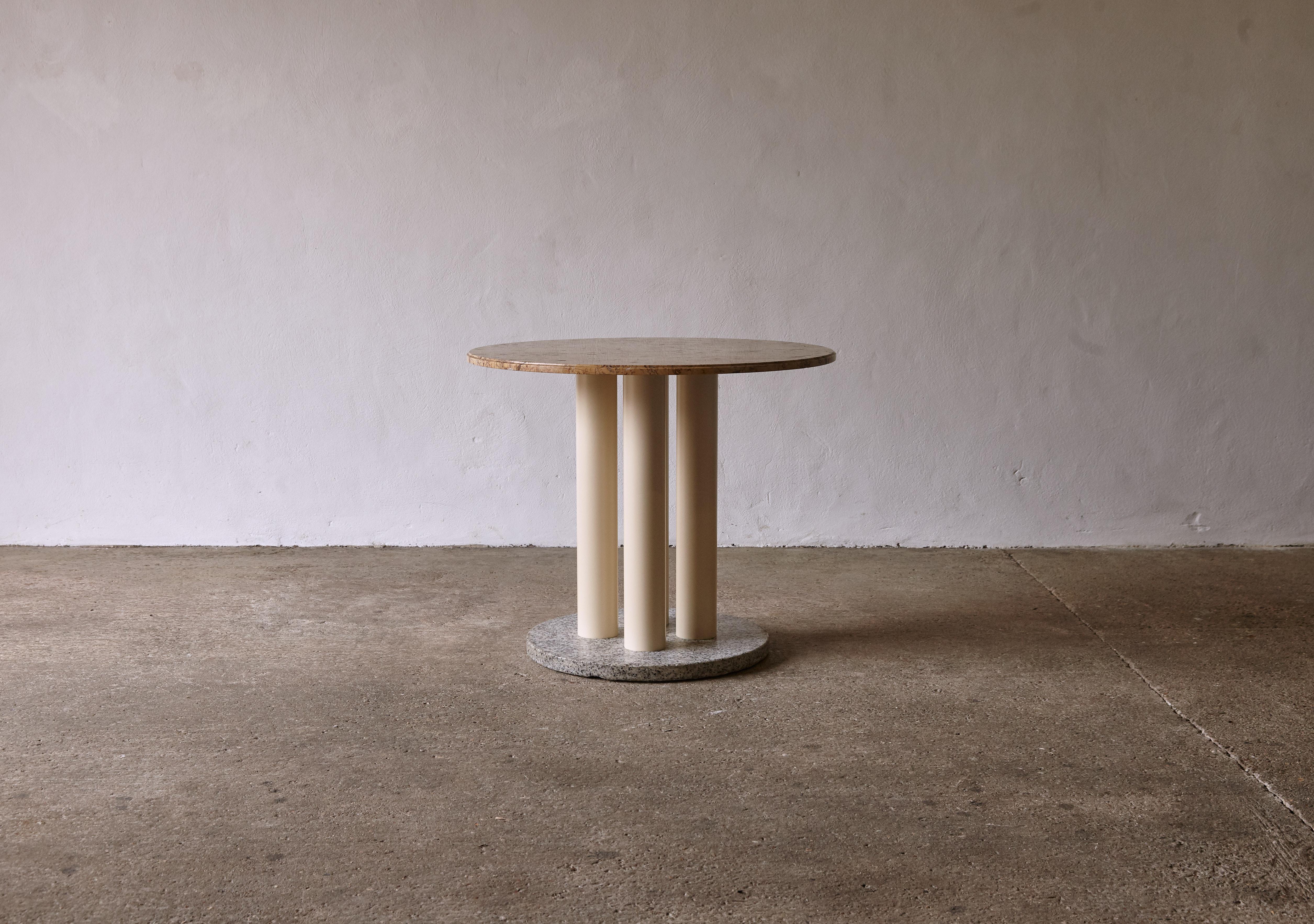 An unusual, unique table in the style of Ettore Sottsass, France, 1970/80s. Black and white stone or marble base, four lacquered metal legs and a reddish / yellow marble or stone top. Fast shipping worldwide.

