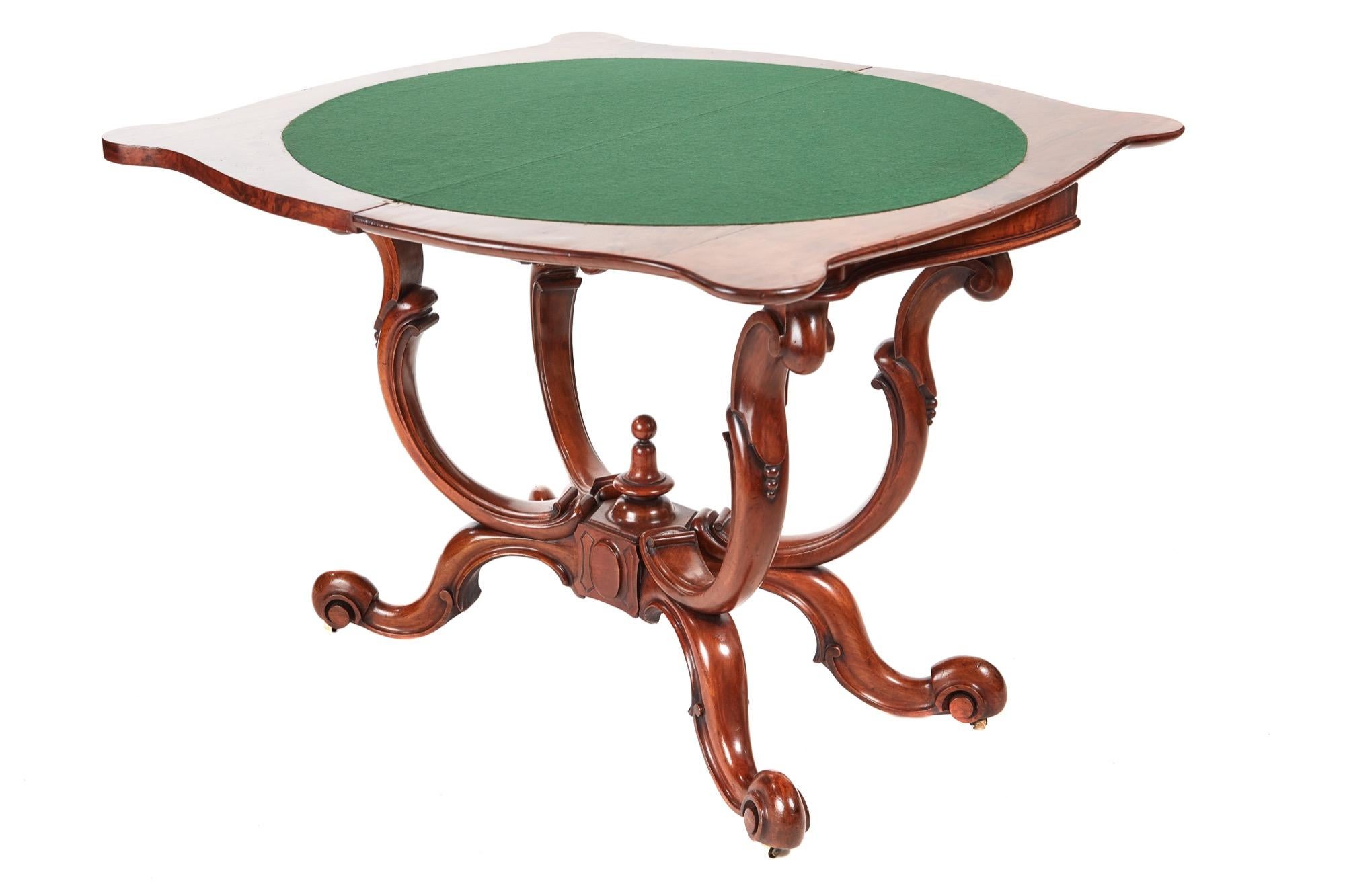 This is an unusual Victorian antique burr walnut basket base card table which has a burr walnut serptentine shaped swivel top with thumb moulded edge. It has a green baize interior with lovely carved walnut frieze. It has an unusual solid walnut