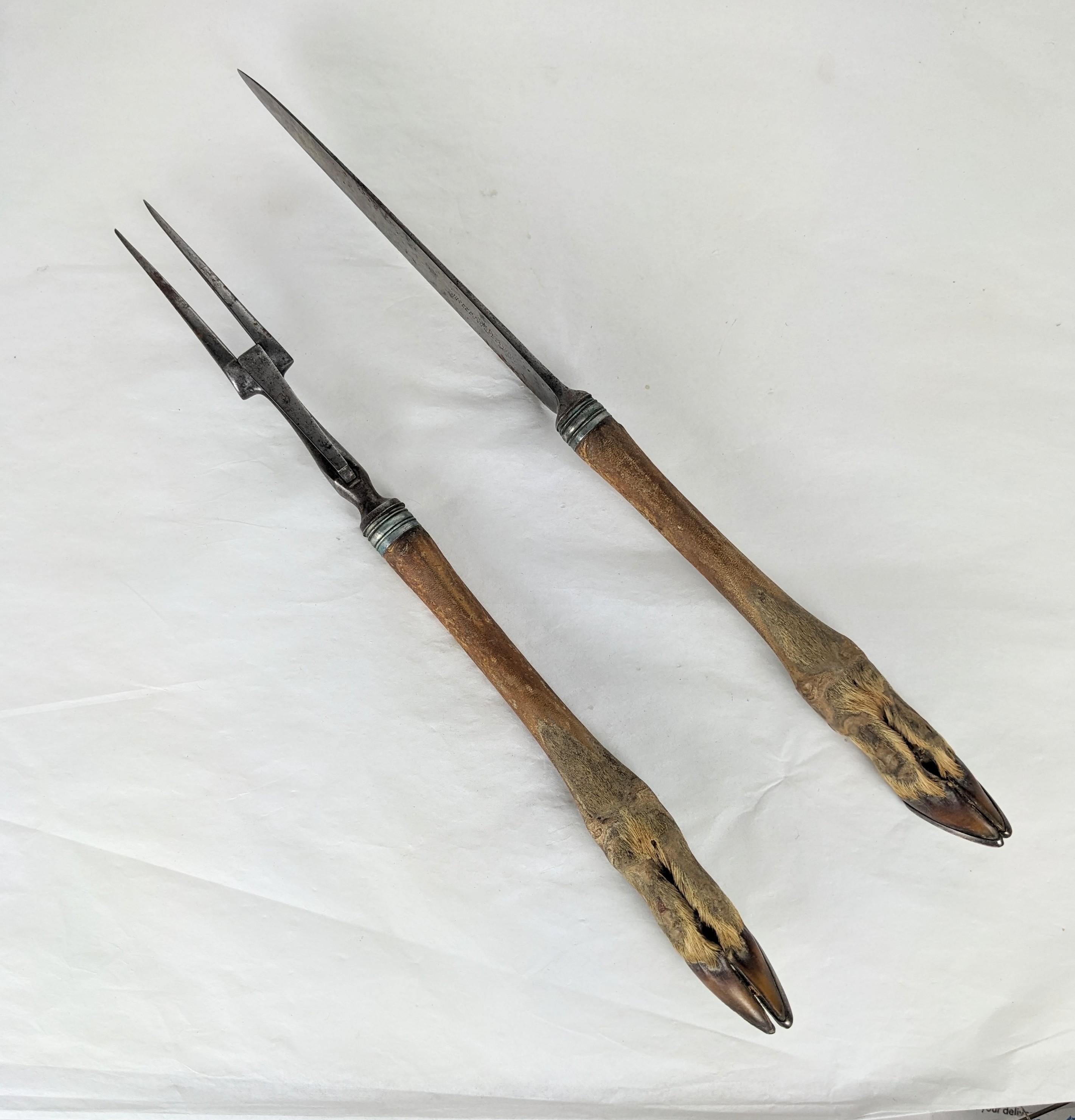 Unusual Victorian Figural Carving Set with deer feet used as handles. Creepy cool utensils for cutting meat from the 19th C. English. 
Each 12.5 x 1
