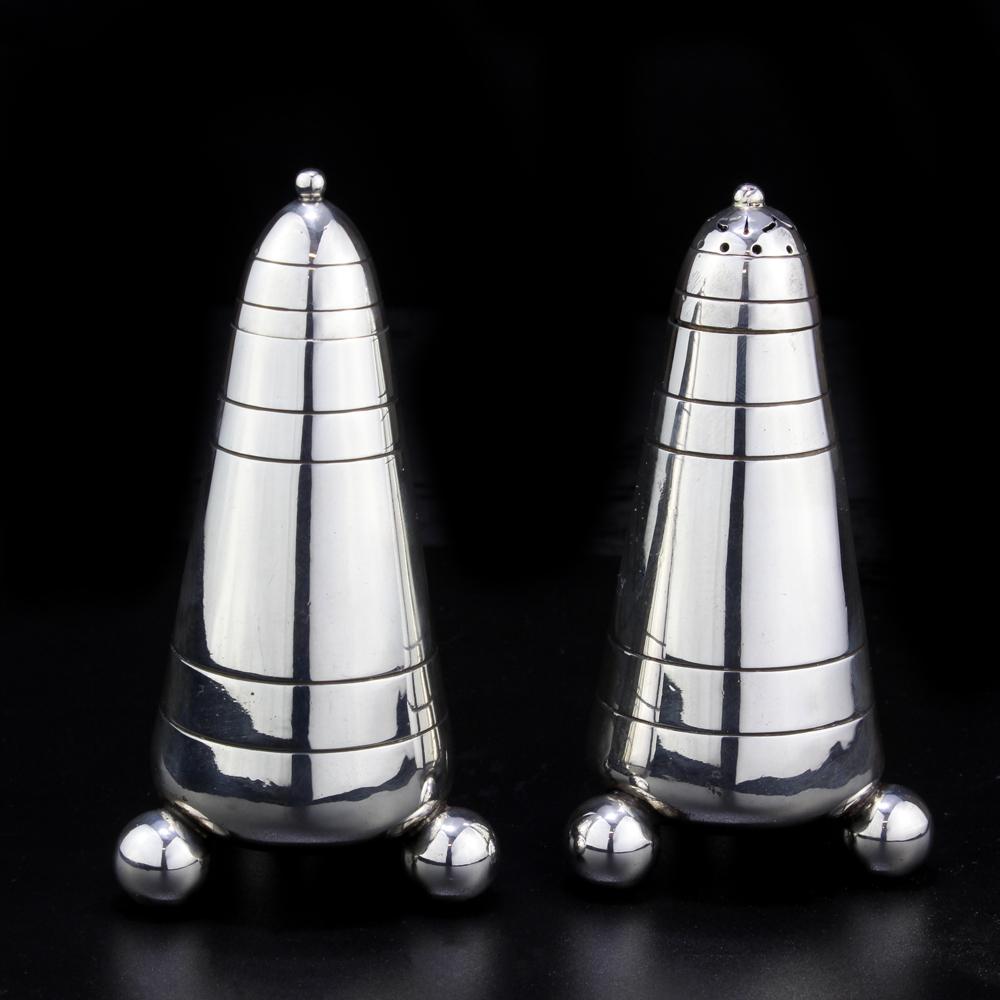 Antique Victorian pair of sterling silver salt and pepper shaker & cellar. The pepper cellar features a lid that also acts as a spoon
Made in London/Sheffield 1874
Maker: Charles Frederick Hancock

Dimensions:
Width x height: 5.5 x 10.5