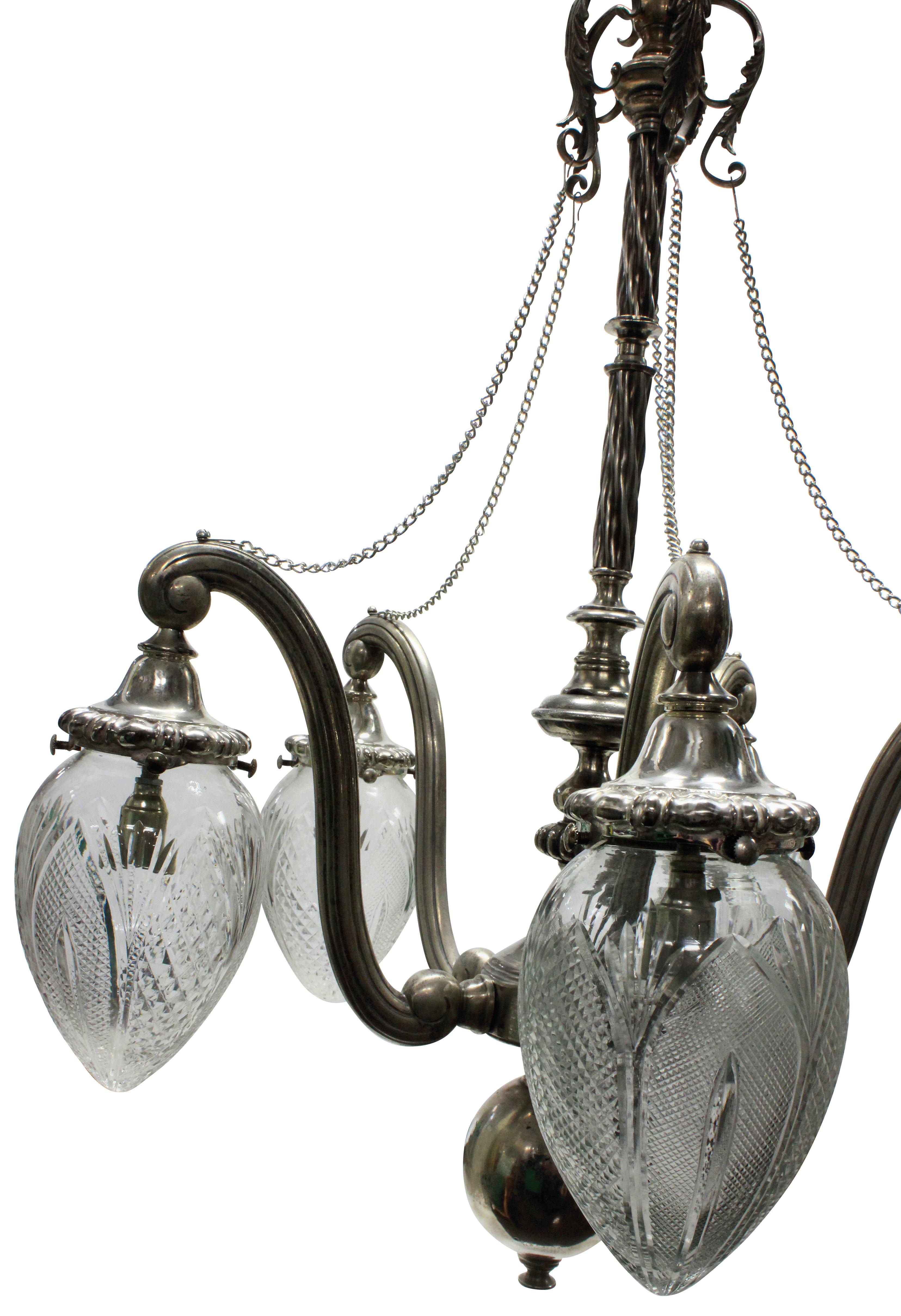 An unusual English Victorian silver plated pendant light with five branches, each holding a cut glass shade.