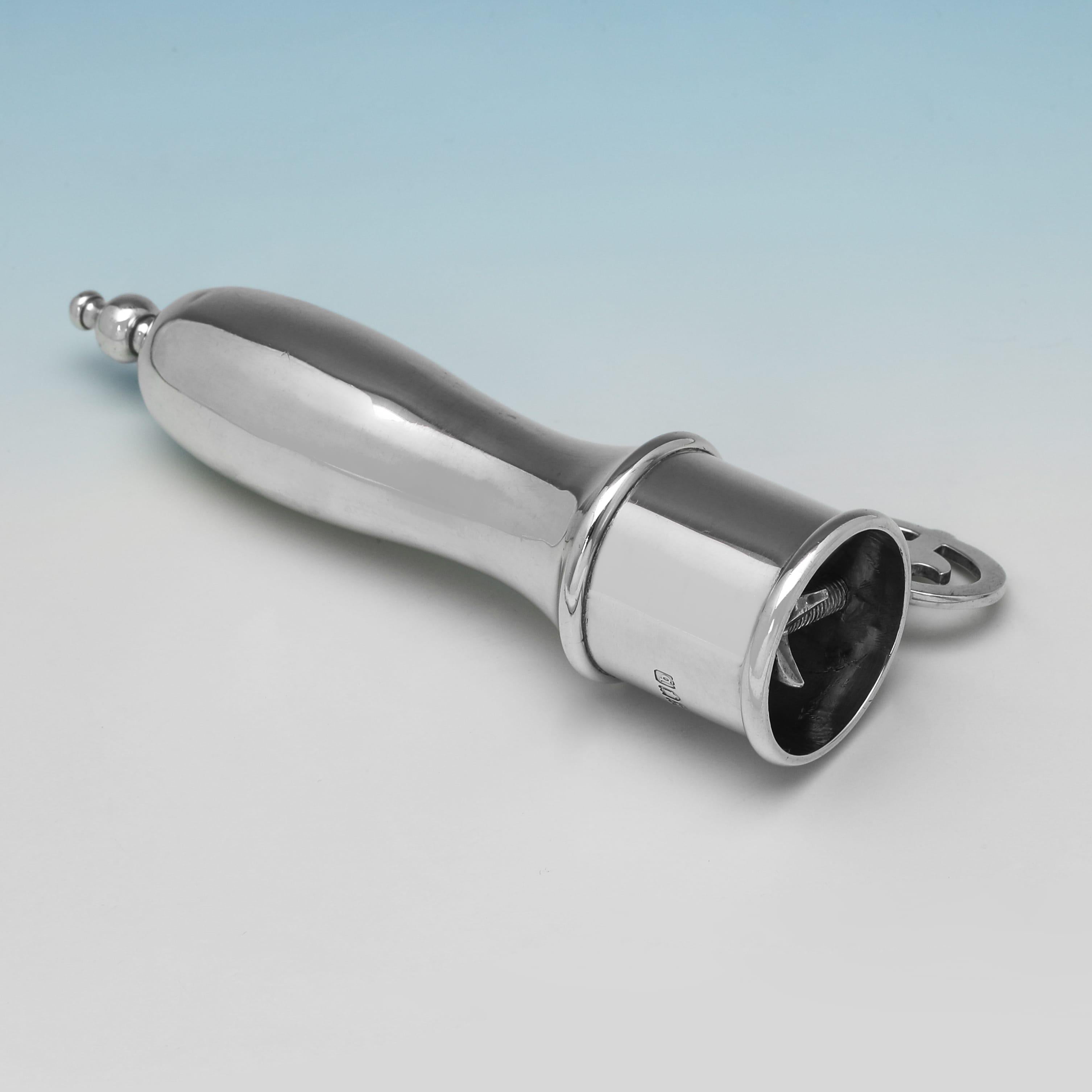 Hallmarked in London in 1897 by John Newton Mappin this unusual 
rare Victorian antique sterling silver ham bone holder has a polished, ergonomic handle with a decorative finial, and a screw-action tightening mechanism at one end. It measures