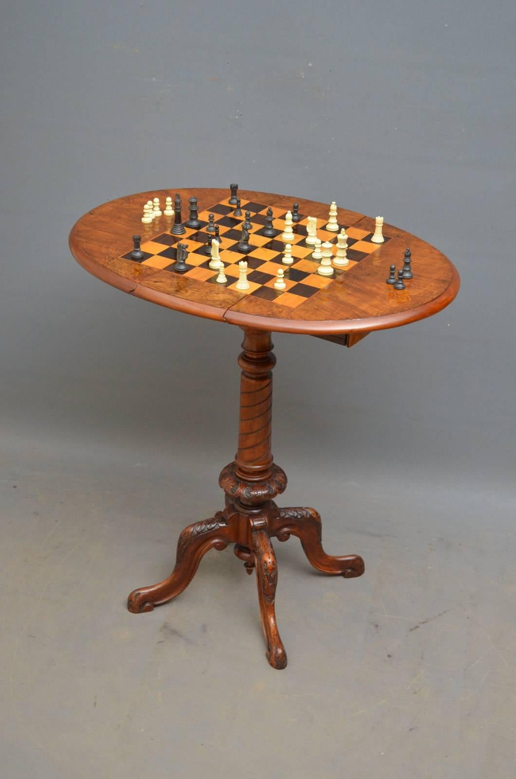 Sn4348, Victorian walnut drop-leaf chess table, having swivel top with satinwood and rosewood chess board above two small drawers and carved and reeded pedestal terminating in four carved cabriole legs, all in wonderful home ready condition, circa