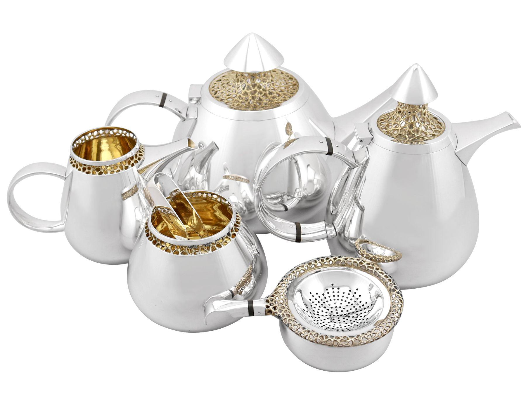 An exceptional, fine, impressive, large and unusual vintage Elizabeth II English sterling silver six piece design tea and coffee service made by Ian Calvert; an addition to our diverse teaware collection.

This exceptional and unusual vintage