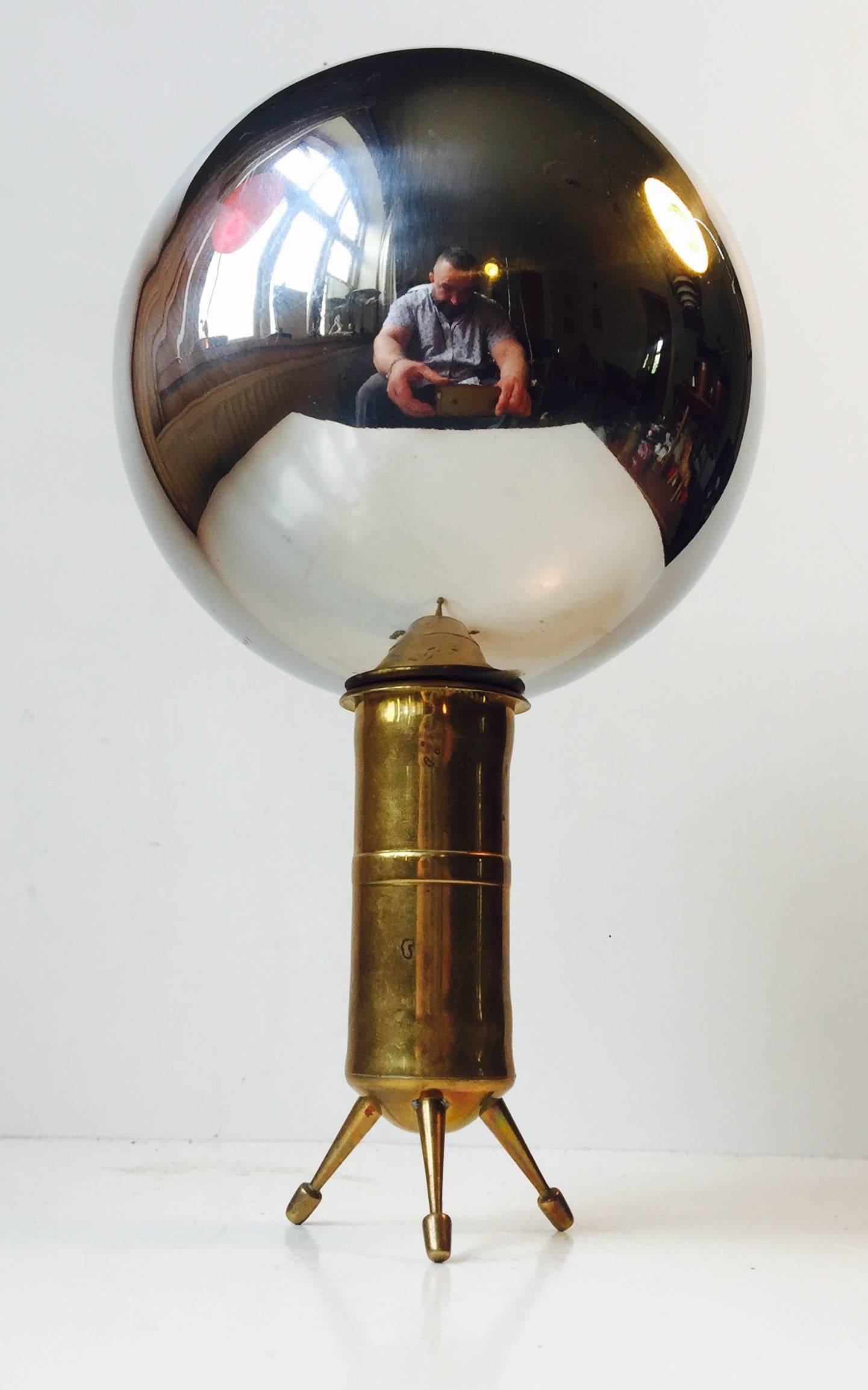 This is a very curious and unusual item. Looking in to this elevated mirror metal sphere the entire room is reflected. You can see things that are in front of you and to the sides. This adds another dimension to the common mirror that 'only'