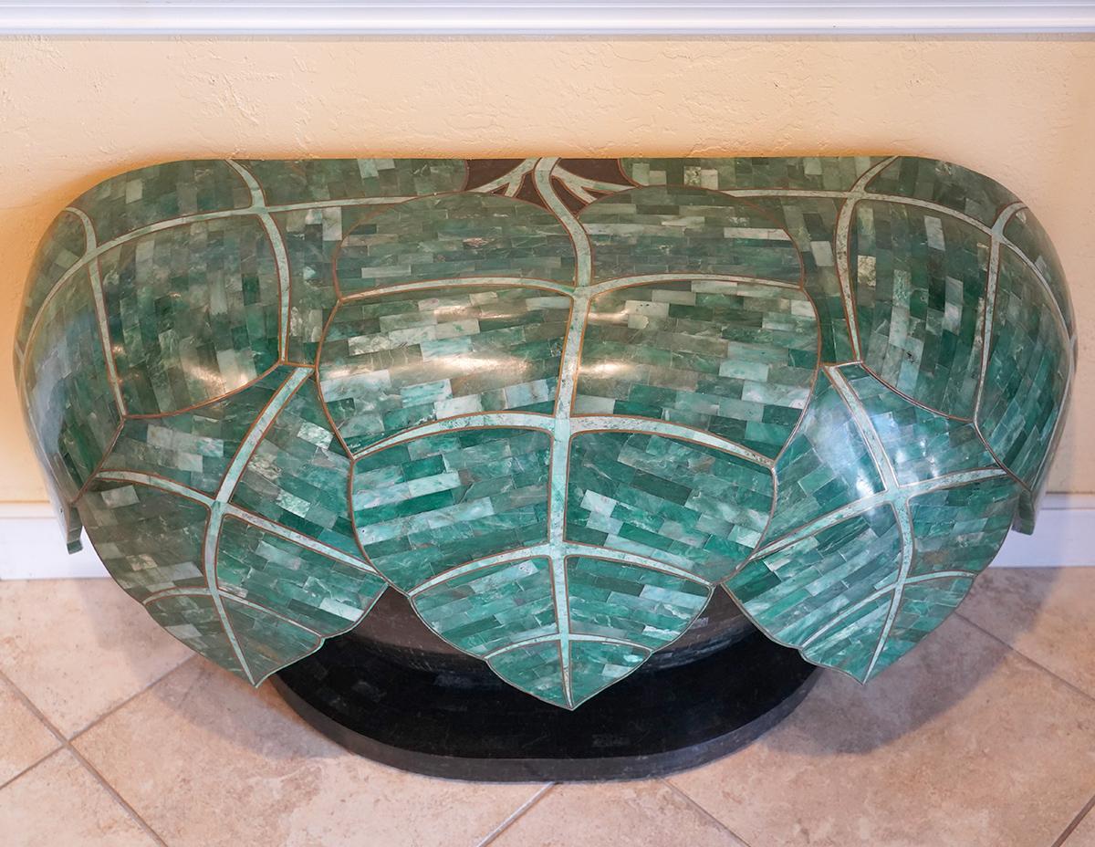 Unusual tessellated Jade and stone palm tree hanging leaf designed console table. Palm tree design includes tessellated jade with brass inlays. Table is comprised of two pieces, a top and bottom. Provenance- La Verne Galleries, Miami 1985. Very good