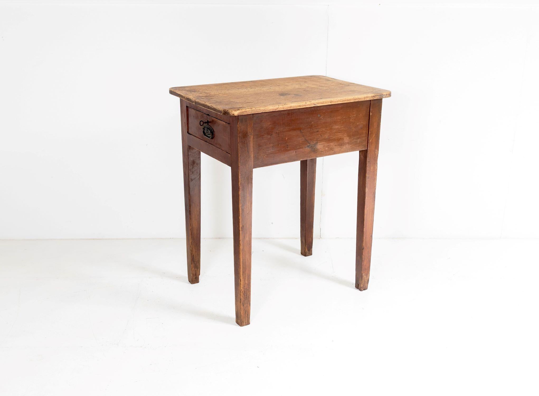 A charming high top church table from a small rural chapel in Wales.  As with all ecclesiastical furniture, this is a well constructed piece made from solid pine, it has a lovely warm tone and worn patina to it.  A small table that is unusually