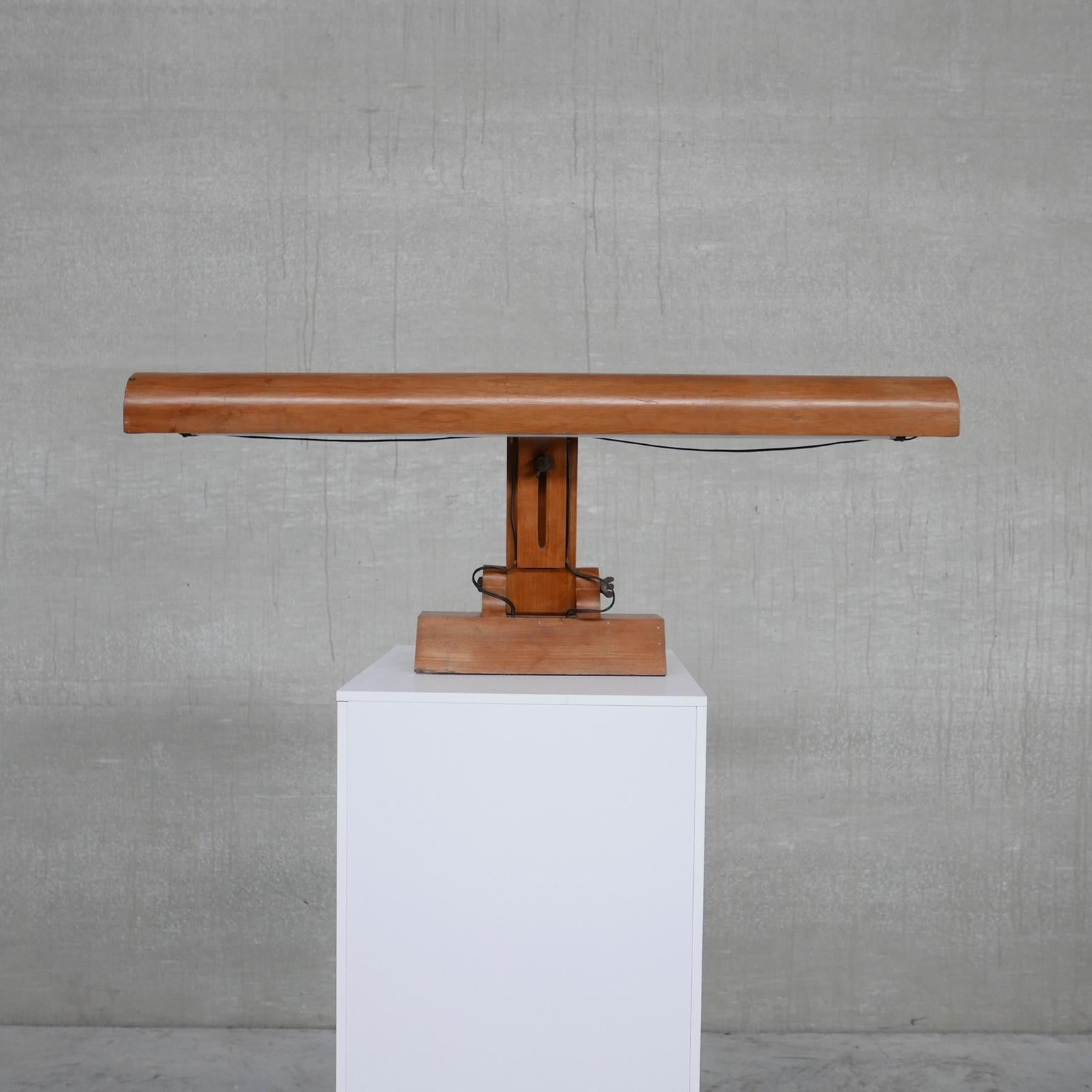 An unusual extra wide table lamp. 

Adjustable in height and angle. 

Belgium, c1940s. 

Possible used in a theatre to read or direct plays/music etc. 

Location: Belgium Gallery. 

Dimensions: 110 W x 20 D x 40 H (lowest) x 51 H (tallest)