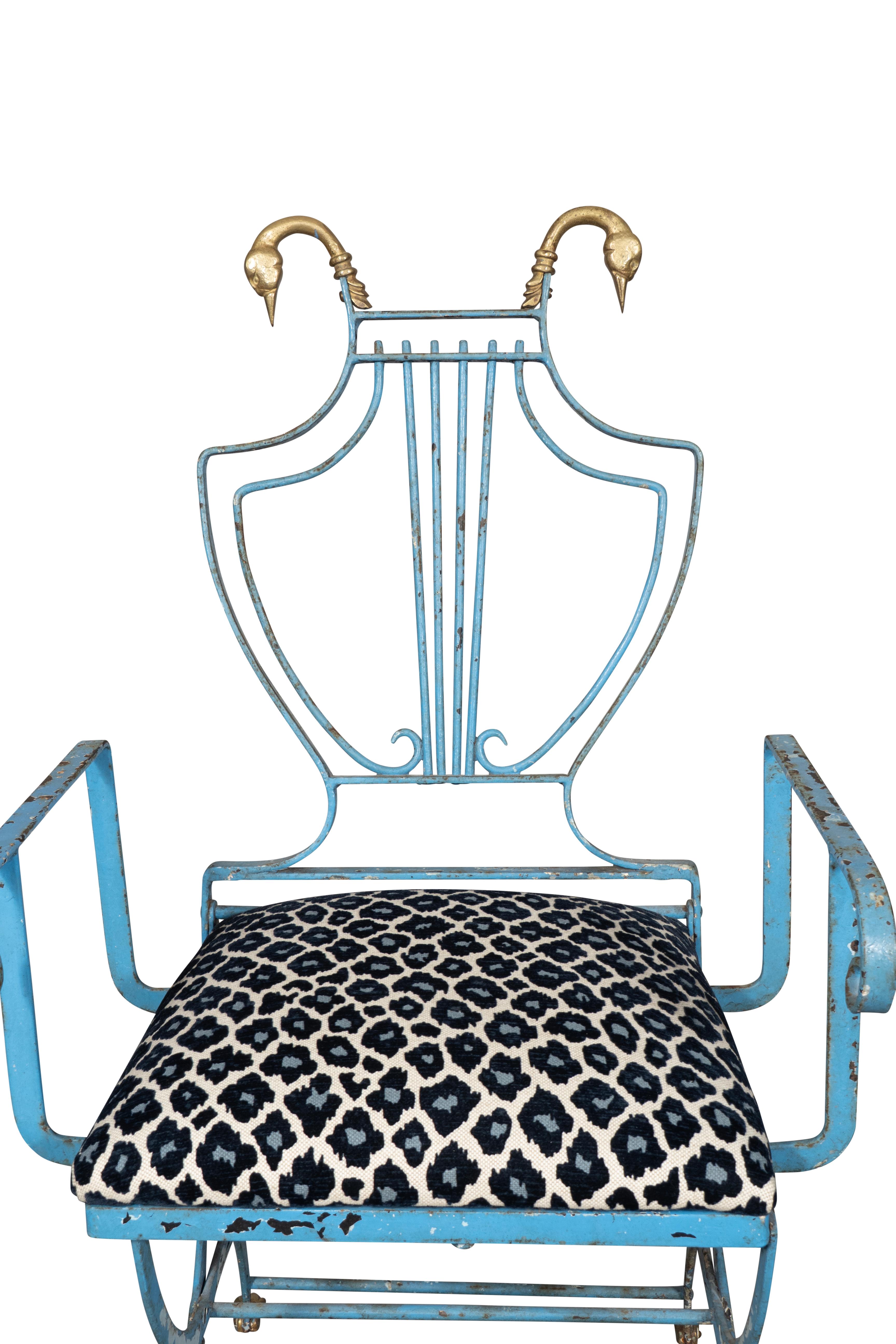 Possibly by Jansen , Paris. With Lyre back and brass bird head terminals. Loose cushion seat and curule form legs with brass paw feet.