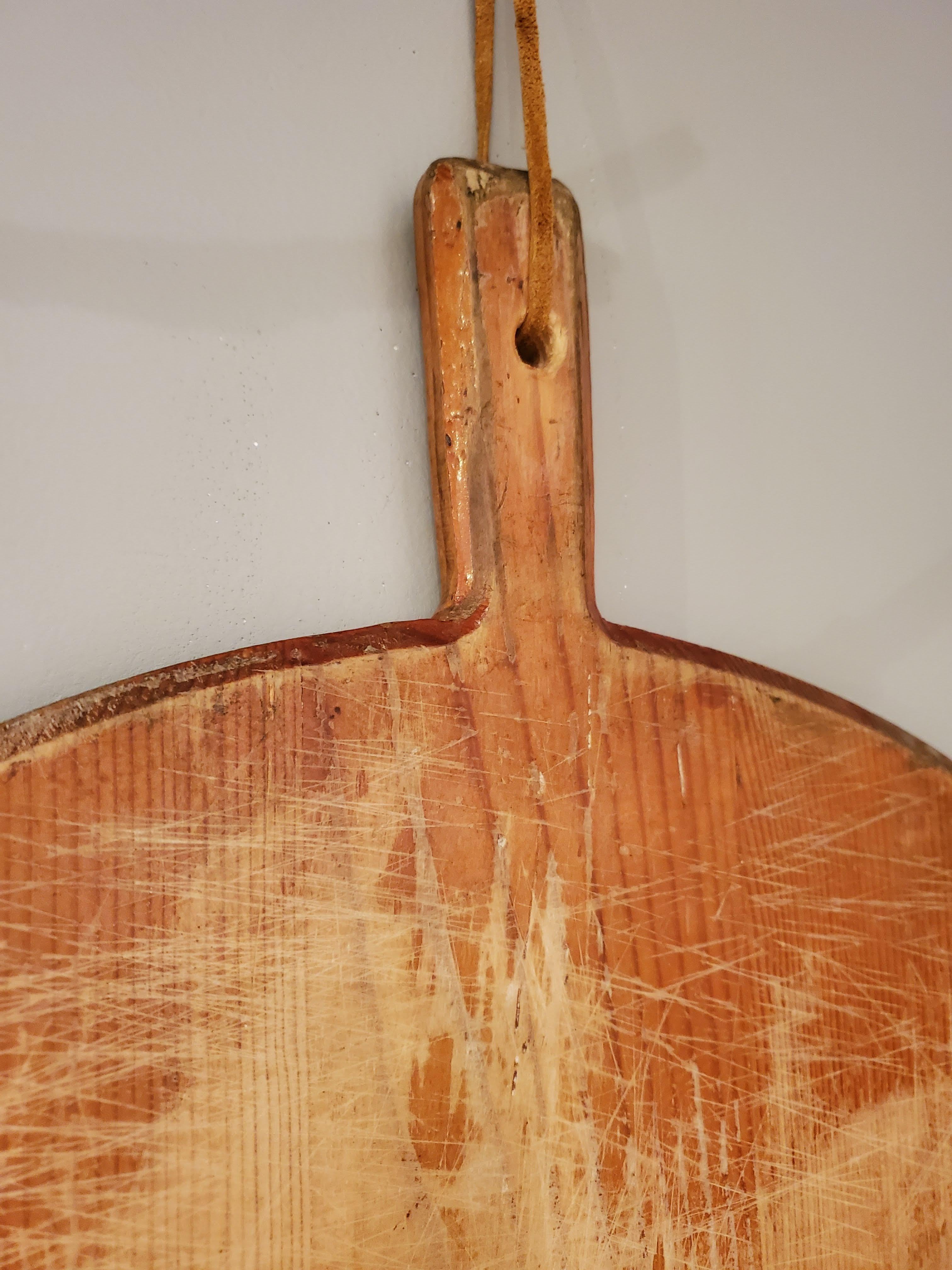 This unusually large 19th century Turkish bread board is a great accessory for your kitchen wall or you can use it for your large party cooking needs. A great quirky piece for those who love to cook. Made of red pine. 
Turkey, circa 1890.