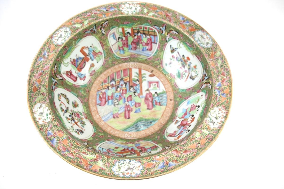 Unusually large ate 19th century Chinese export porcelain rose Mandarin wash bowl, the interior with six fan-form figural and floral cartouches. Possessing butterflies, bats, and birds about the interior and the rim. The exterior features floral