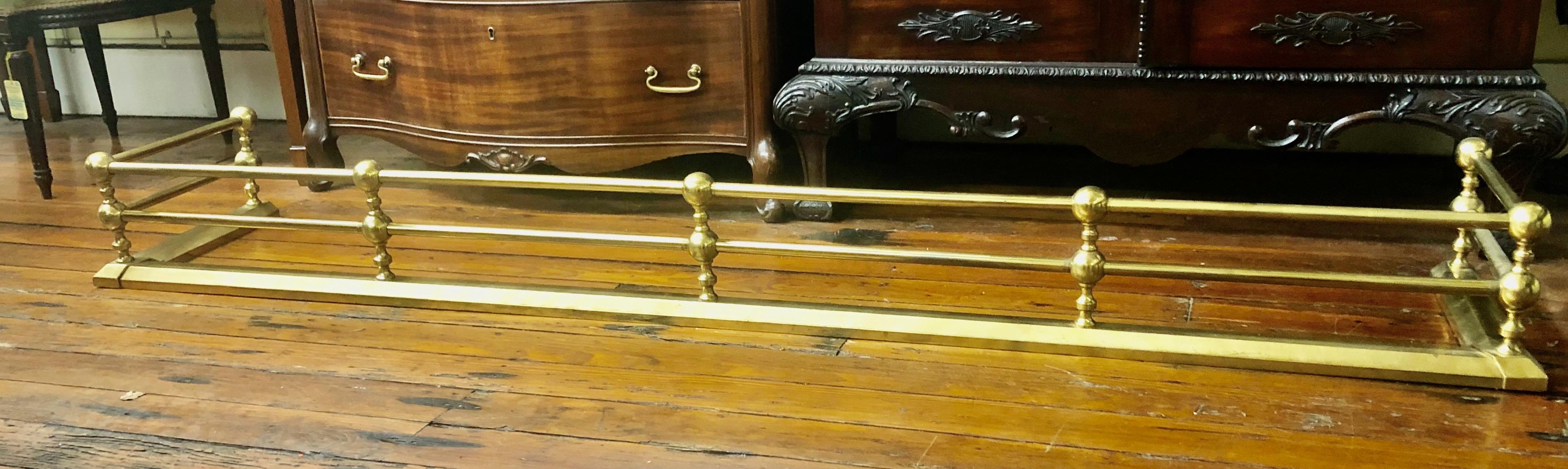 Very rare unusually long size solid brass rail style fender, probably custom made for an unusually wide fireplace hearth.