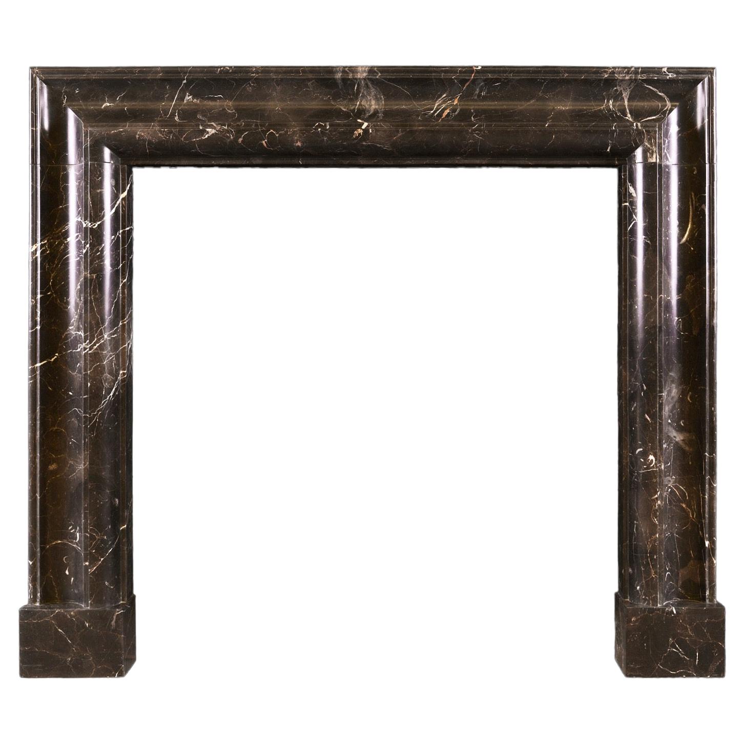 Unusually Shaped English Bolection Moulded Fireplace in Dark Emperador Marble