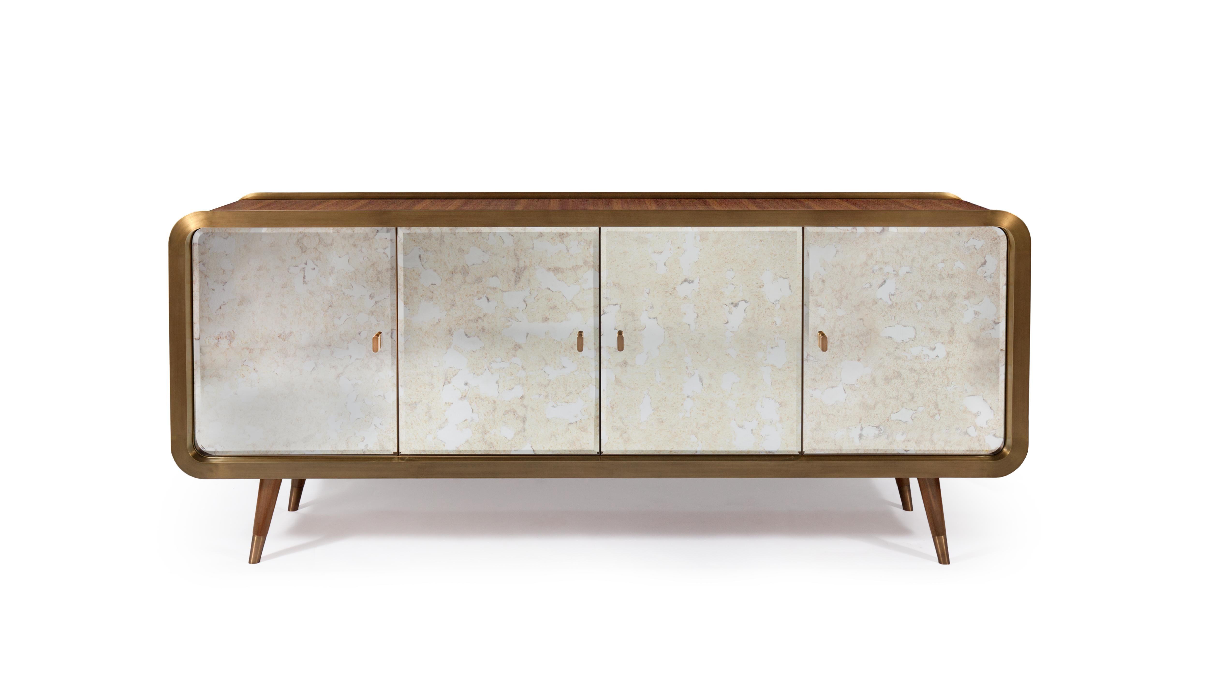 Unveil Sideboard 200 by InsidherLand
Dimensions: D 50 x W 200 x H 85 cm.
Materials: 
Wooden structure: walnut veneer and interior in sycamore veneer. Doors: aged mirror. Shelves: bronze glass. Metal frame, handles and feet: brushed bronzed brass in