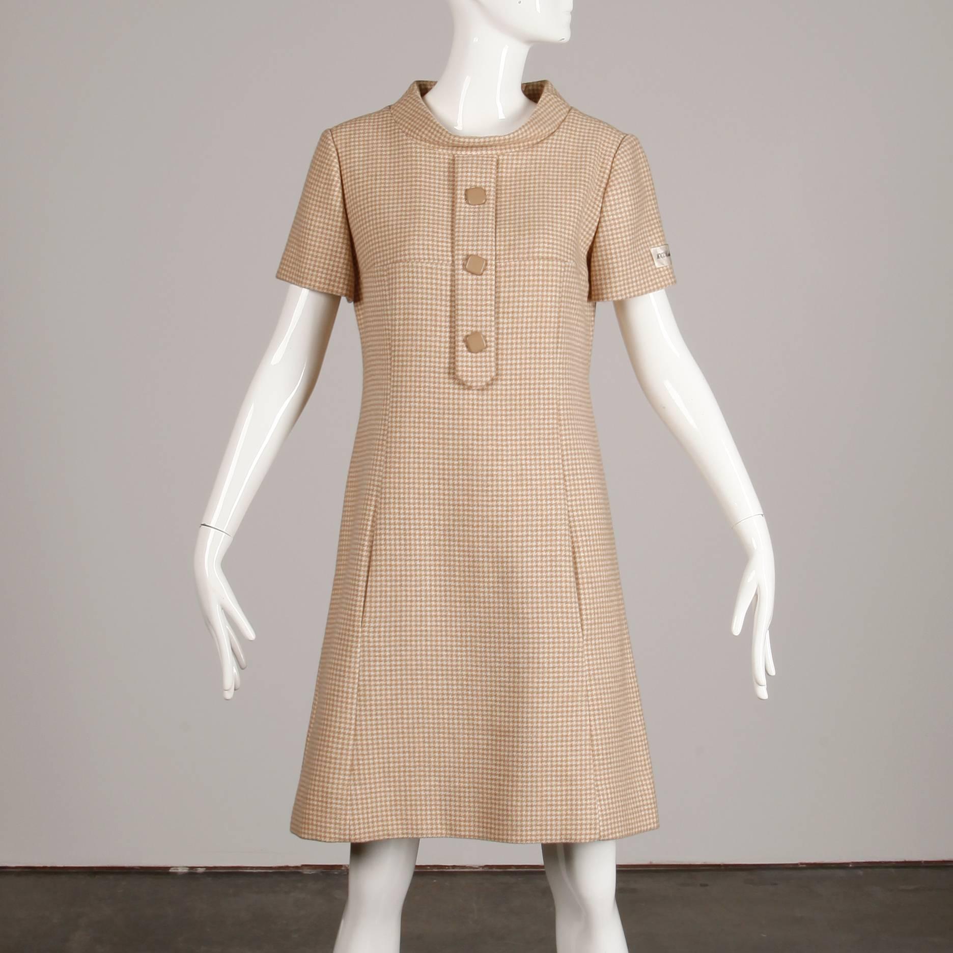 Unworn with the original tag still attached to the sleeve! Vintage 1960s shift dress by Charles Cooper in super soft beige and off white cashmere. Fully lined with rear zip closure. Front hidden pockets. 100% cashmere. Fits like a modern size