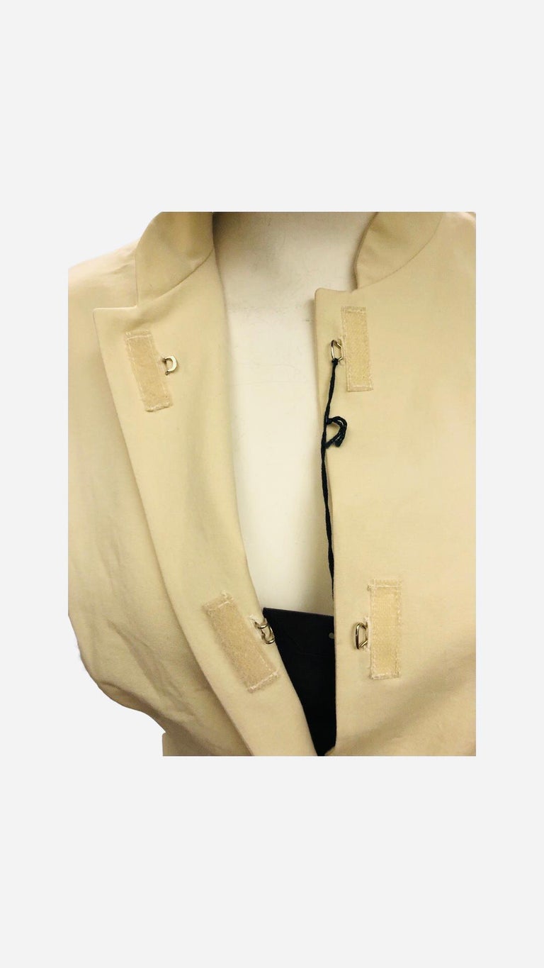 - Prada beige cotton/spandex mandarin collar sleeveless top from spring 1998 collection. 

- Velcro and hook closure. 

- 95% cotton, 5 % spandex. 

- Size 44. 

- Unworn and attached with original tag. 
