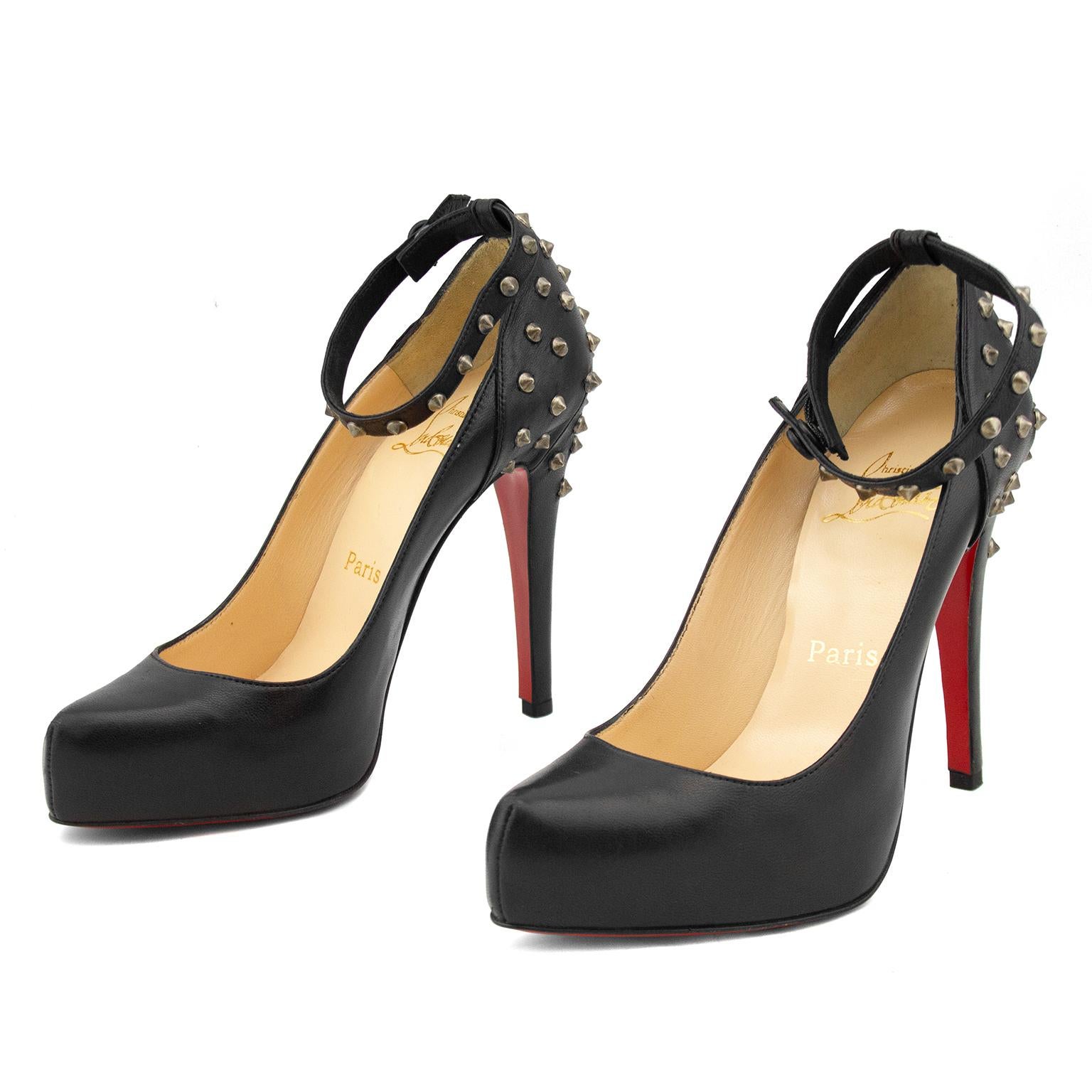 Unworn Christina Louboutin extreme high heels from the early 2000's. Supple black leather with silver studs up the heel and along the ankle strap. Excellent condition - the iconic Louboutin red soles have no wear. Size 37.5