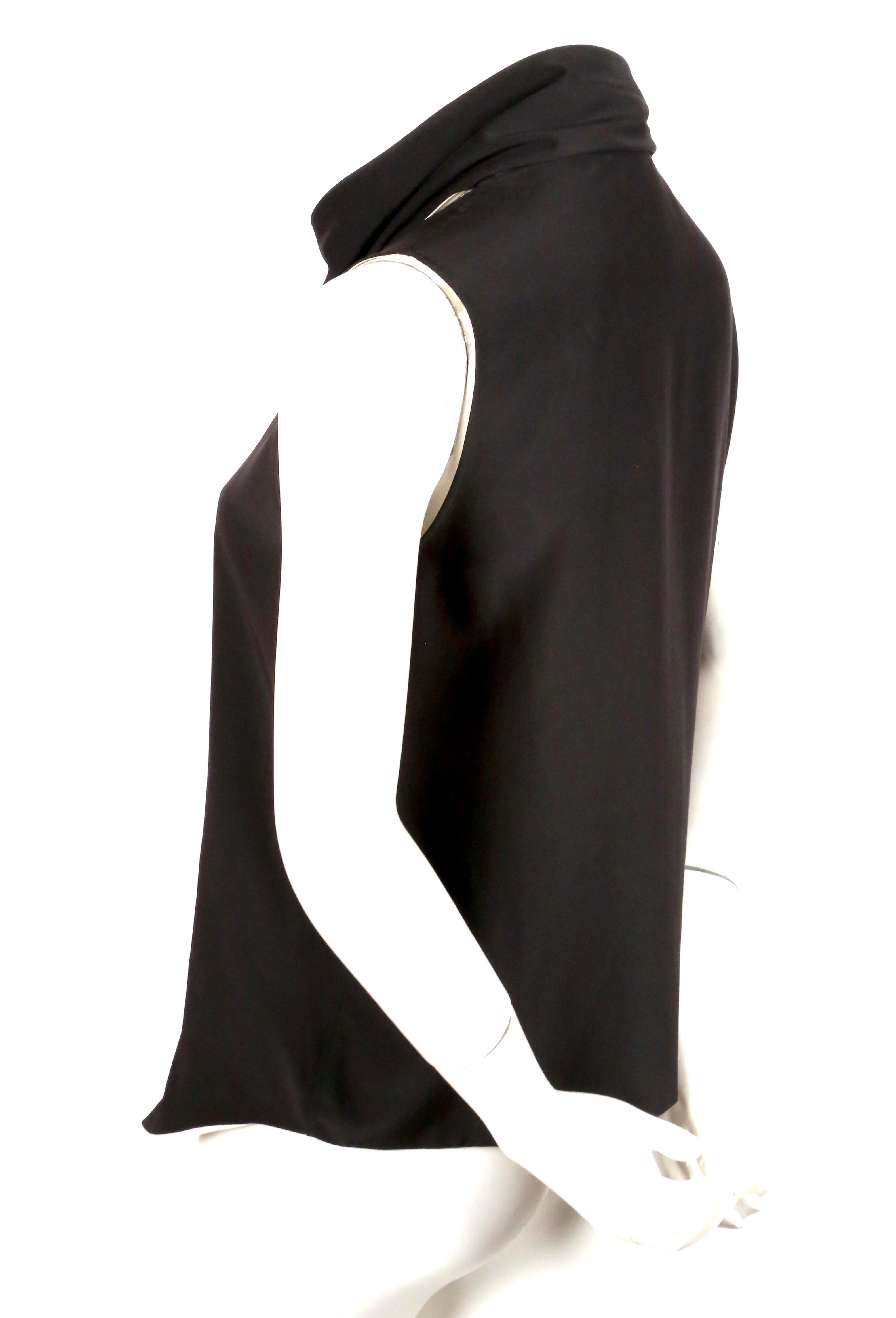 Black and cream silk top with draped wrap scarf neckline designed by Phoebe Philo for her first collection for Celine - Resort 2010. French size 36. Measures approximately: 14
