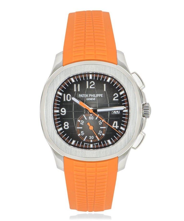 An Aquanaut  42.2mm in stainless steel by Patek Philippe. Featuring a black embossed dial that features the date and a orange chronograph display. The orange Patek Philippe composite strap is fitted and is equipped with the Aquanaut fold-over clasp