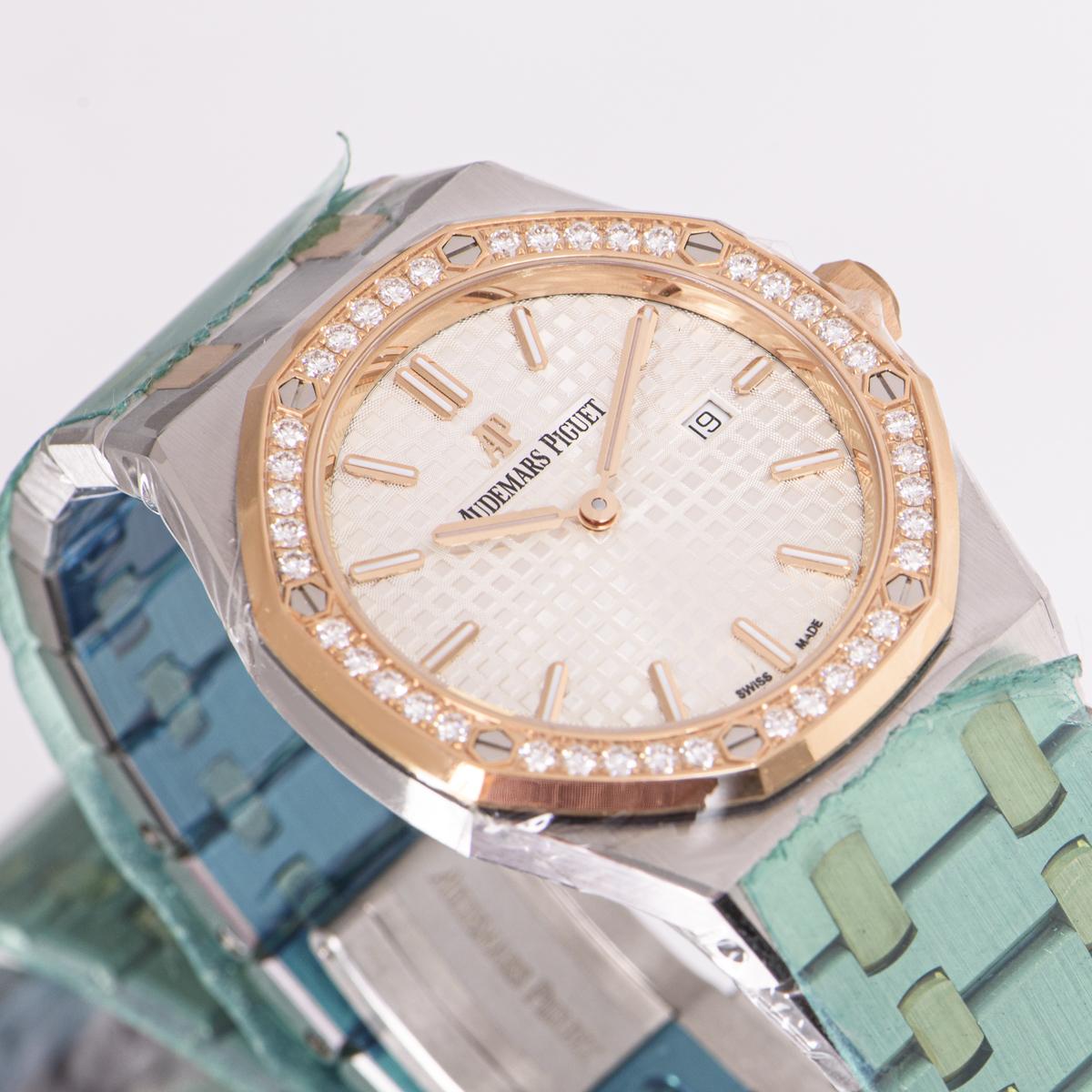 An unworn 33mm Royal Oak Lady in stainless steel and rose gold from Audemars Piguet. Features a silver-toned dial with a 
