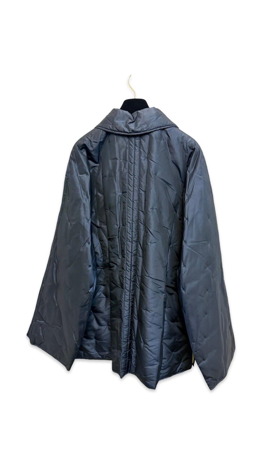 - Unworn with original tag Chanel blue and yellow silk reversible double side jacket from Fall 1997 collection. 

- Four front zip closure pockets on the blue side. Four slip front pockets on the yellow side. 

- Silver hardware 