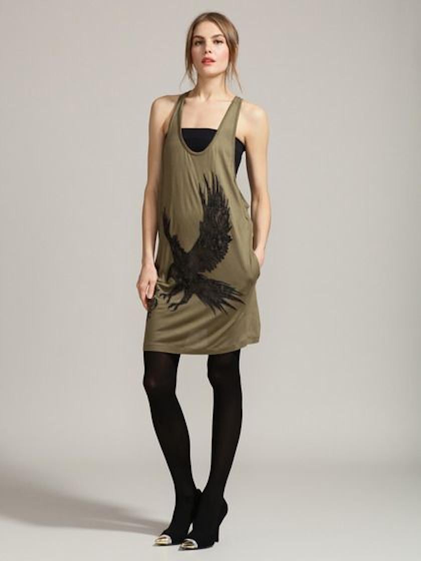 Emilio Pucci's olive tank dress with a black lace eagle appliqué makes a fabulous urban staple. Wear it to the beach or complement the low racer back and louche cut with spray-on leather pants and studded heels for the coolest downtown look.