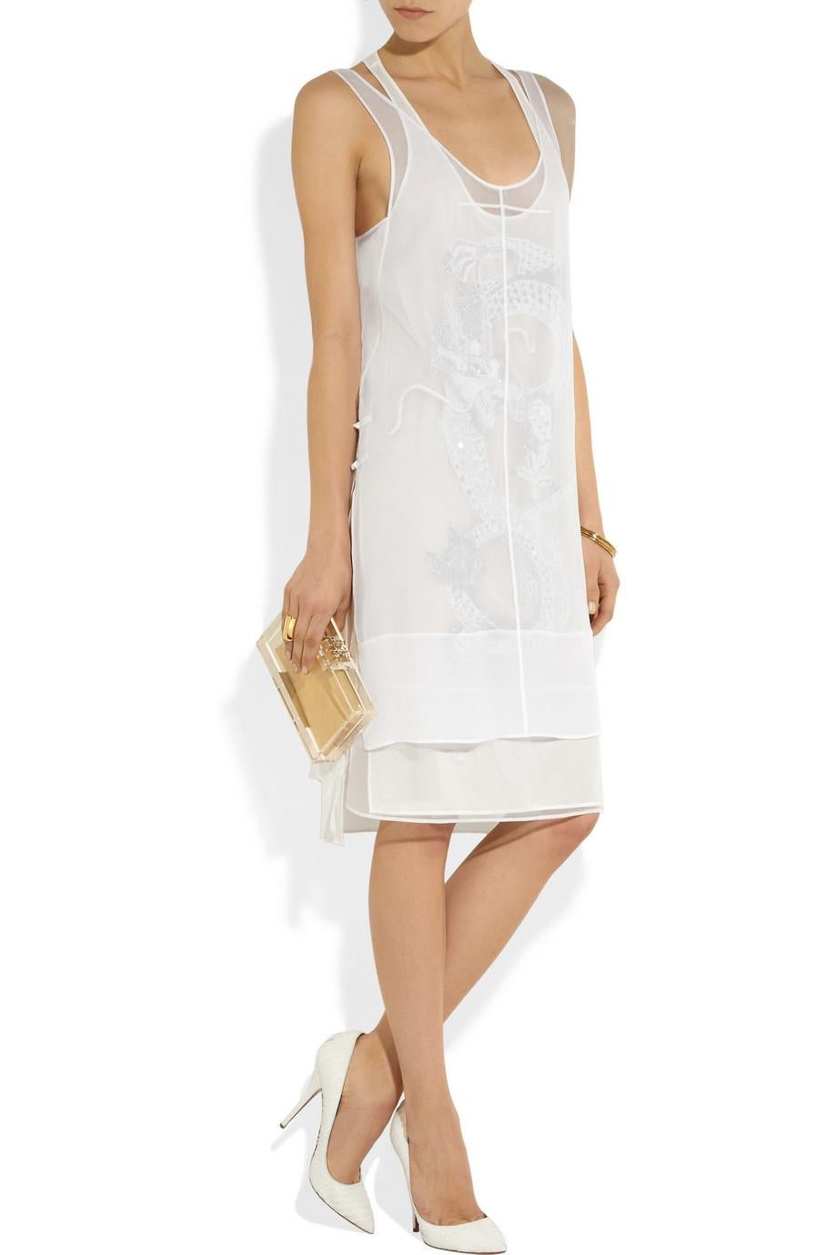 This Emilio Pucci dress combines light, sheer fabric with a curve-hugging silhouette, for a look that is both glamorous and leisurely. Intricate embroidery inspired by Vietnamese art add compelling visual complexity.

A layer of sheer silk-chiffon