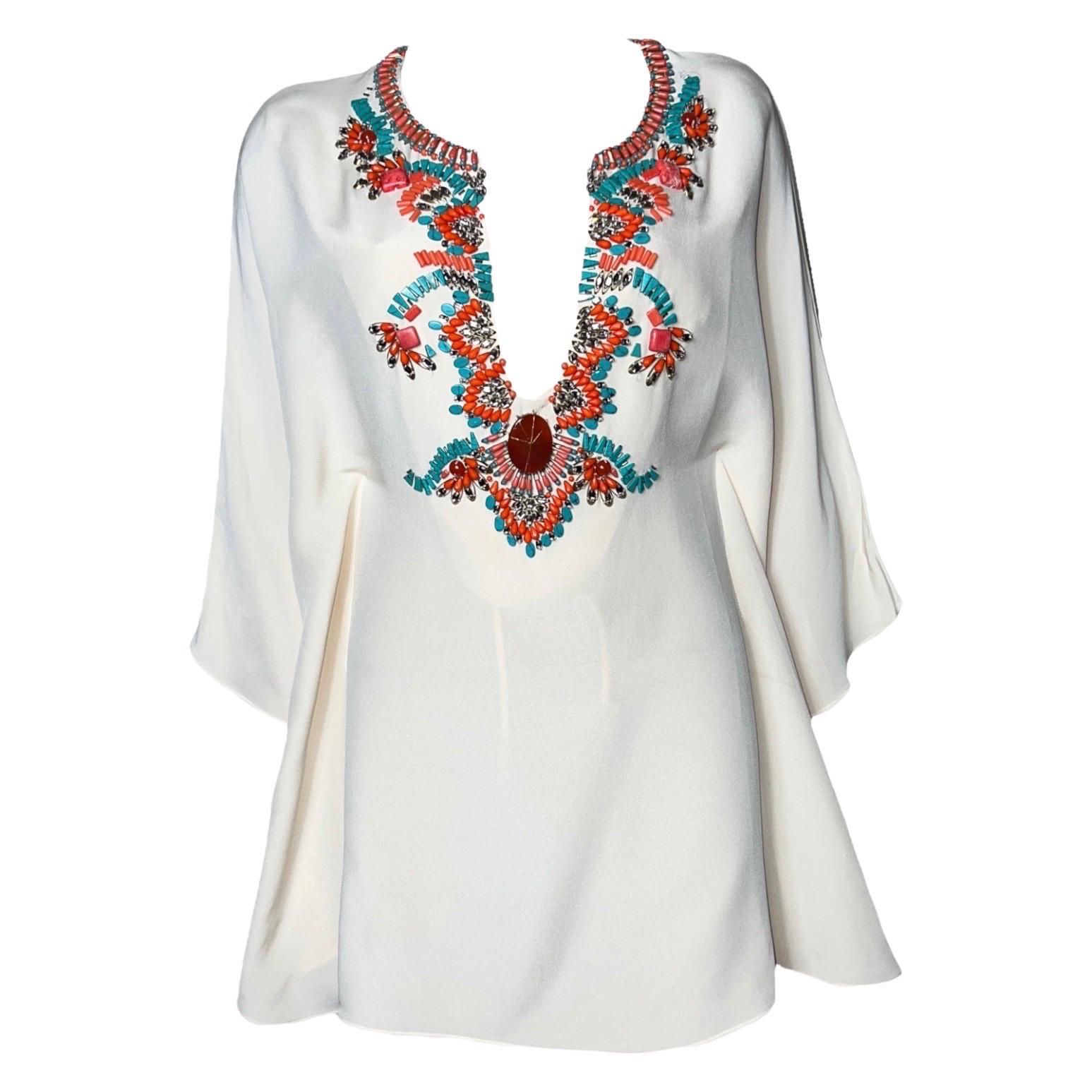 Emilio Pucci's embroidered kaftan is perfect for chic summer parties. Crafted in Italy from luxurious cream silk-cady, this design has an amazing fit, front ties and embellishments made from colorful beads and crystals. Team yours with a clutch and
