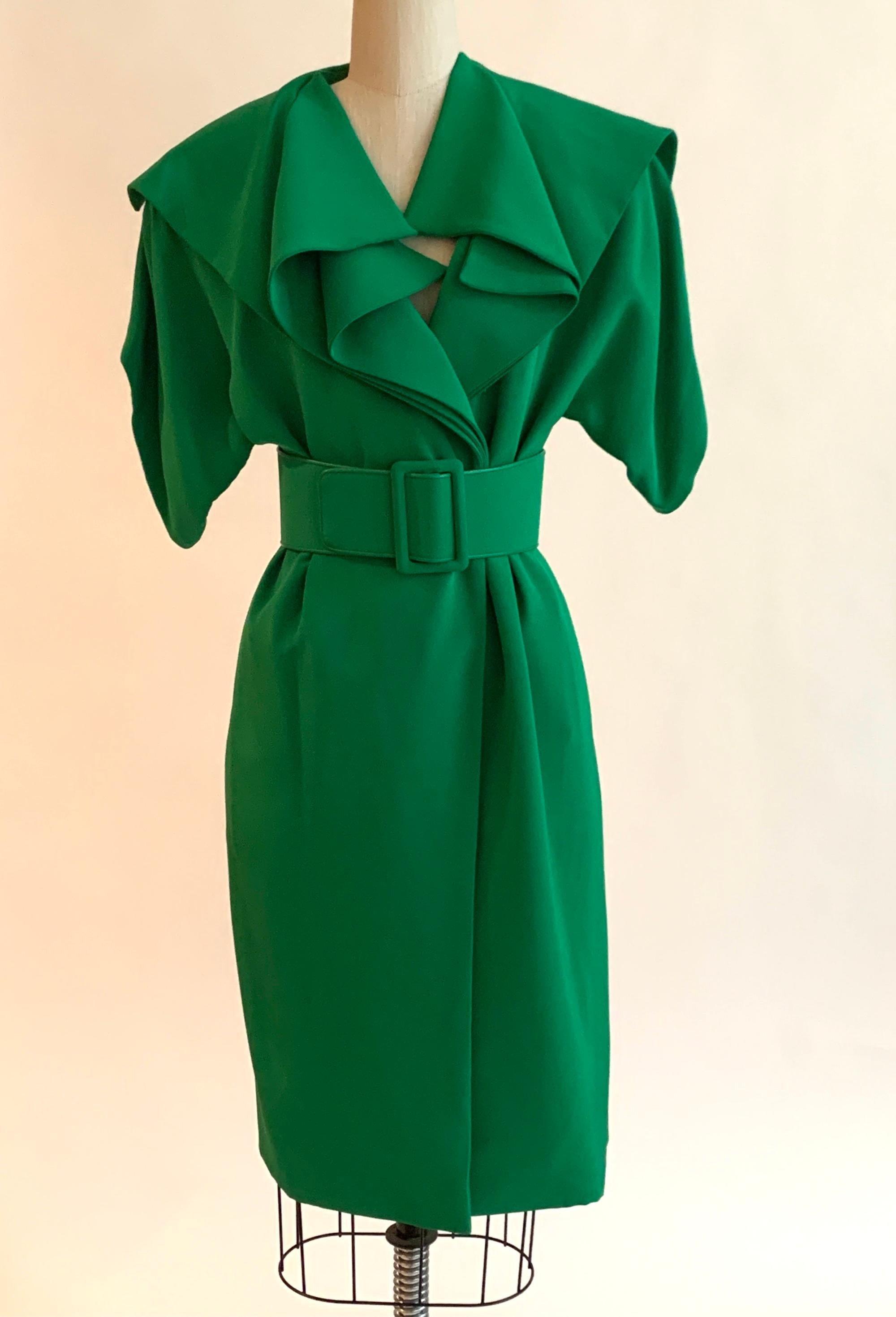 Vintage James Galanos kelly green coat dress with a beautifully draped shawl collar and short sleeves. Could be worn as a dress or as a coat. Fastens with three snaps near waist and belt. 

No content label, feels like a mid-weight silky fabric.