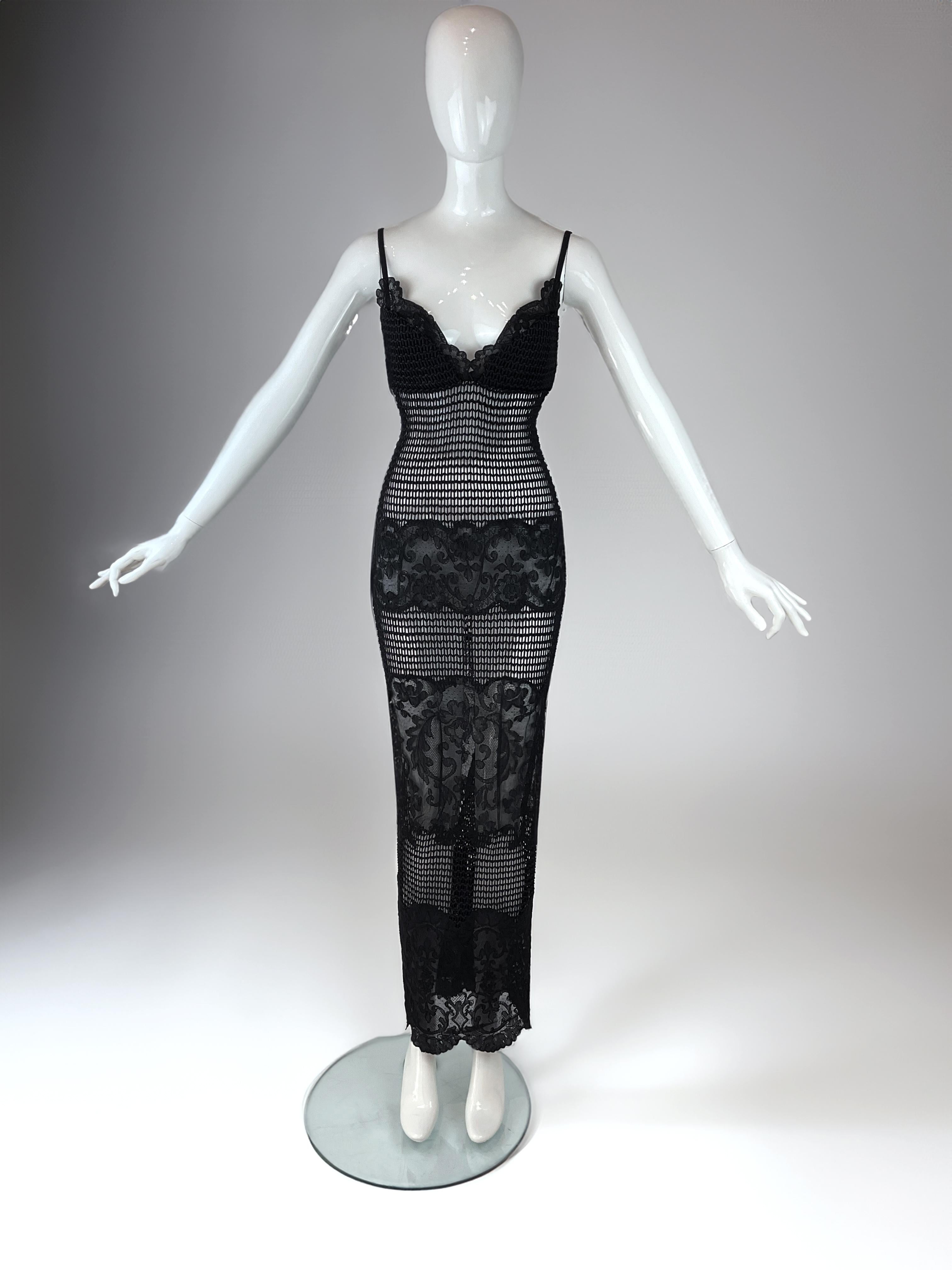 This original Gianni Versace gown from the Fall/Winter 1993 runway collection remains in unworn, pristine condition & exceptionally rare for a piece of this age and historical relevance.

The gown is constructed from alternating panels of sheer
