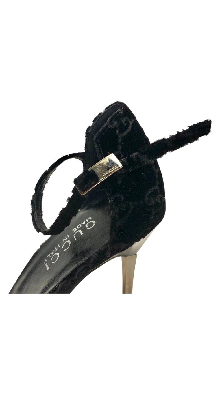 - Gucci by Tom Ford black velvet monogram strap high heels from Fall 1997 collection. (Like new that has never been worn before). 

- Featuring silver plated heels. 

- Size 38. 

