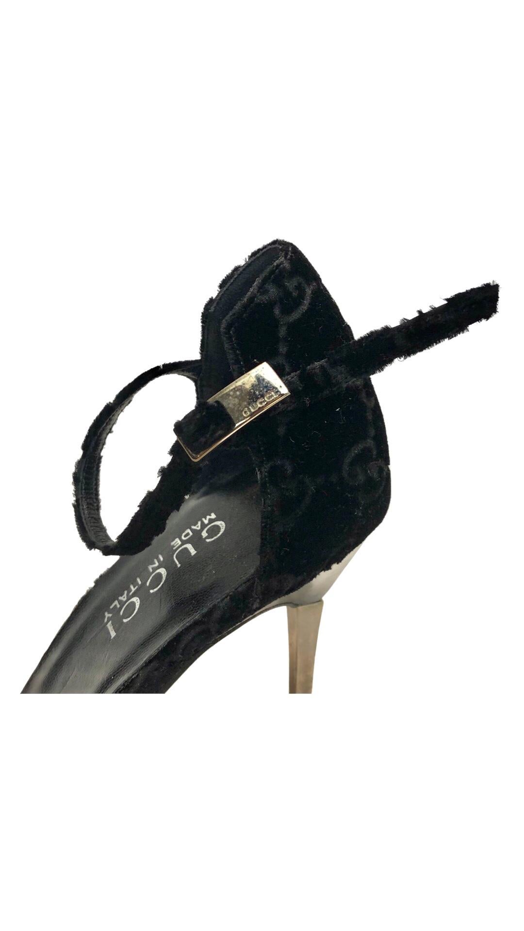 -Iconic Gucci by Tom Ford black pointy velvet monogram strap high heels from Fall 1997 collection. 

- Featuring silver plated heels. 

- Size 38. 

- The rubber sole has to be replaced and we will fix it for you after purchase. 

