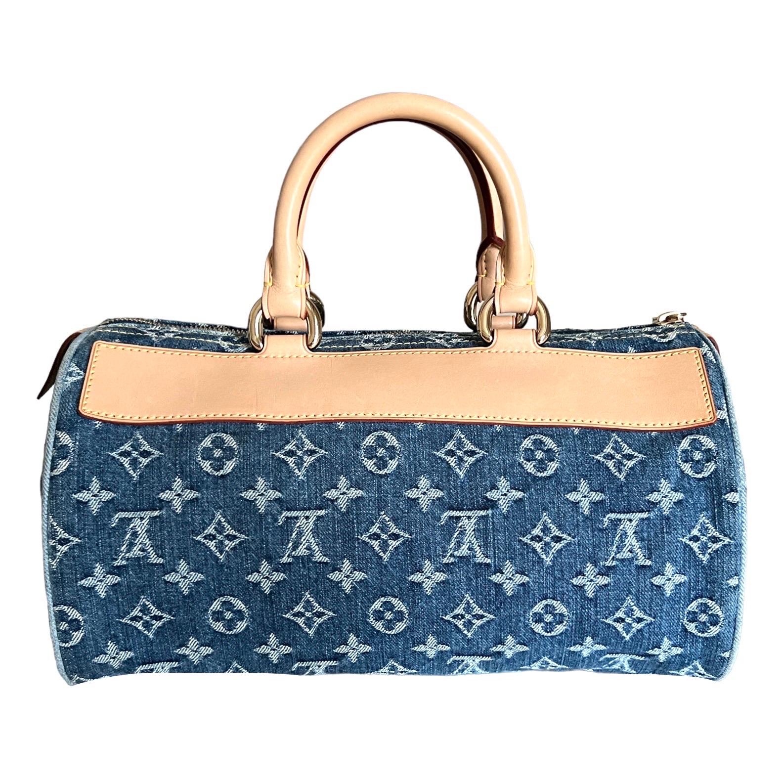 LIMITED EDITION - A rare gem by Louis Vuitton designed by Marc Jacobs
Indigo blue distressed denim with the famous LV monogram 
Vachetta leather trimmings
Closes on top with zipper
Three front pockets, one inner pocket
Rount top handles
Gold-tone