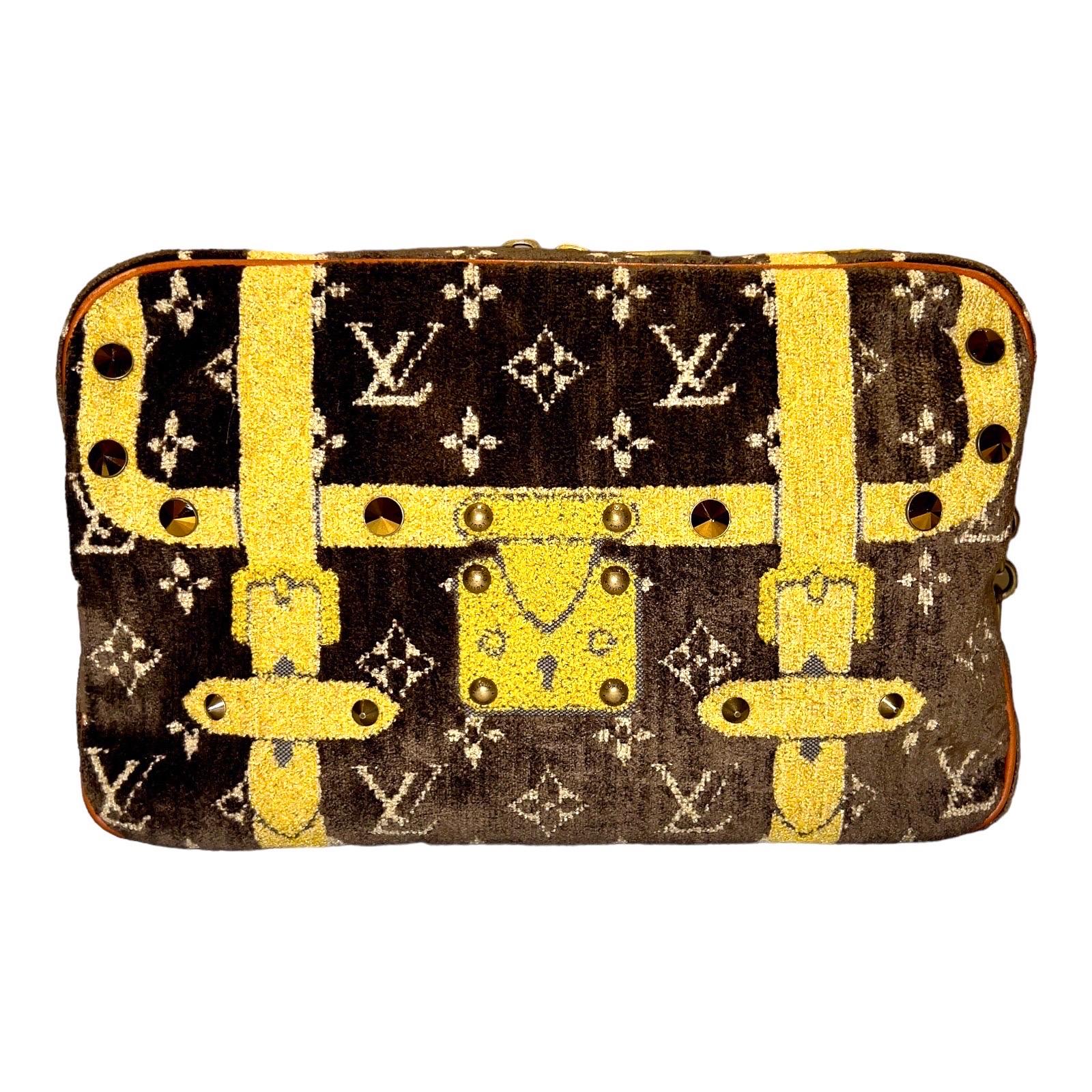 A Louis Vuitton signature piece that will last you for many years, from one of Vuitton's most stunning collections designed by Marc Jacobs.

Crafted from brown monogram velvet, this fabulous bag features shoulder chains with crocodile shoulder pads